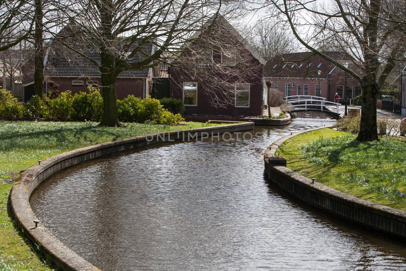Picturesque village with antique houses next to the water in the Netherlands