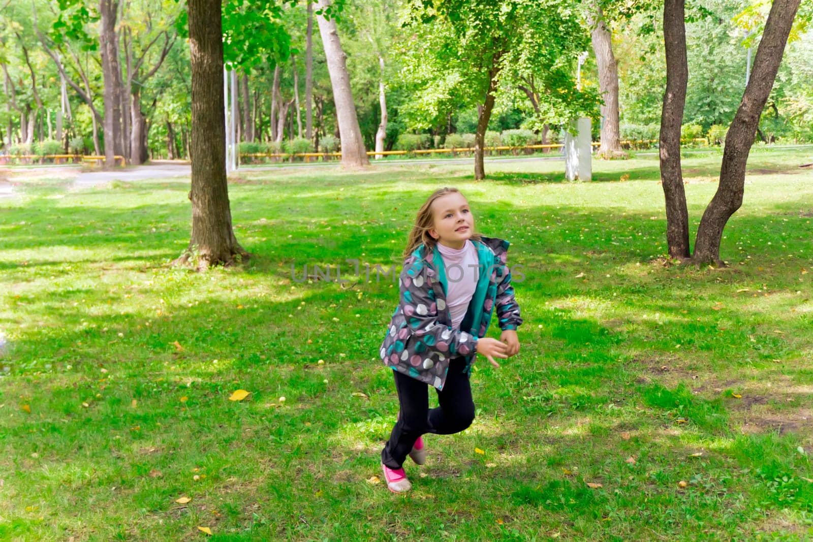 Photo of cute running girl in summer
