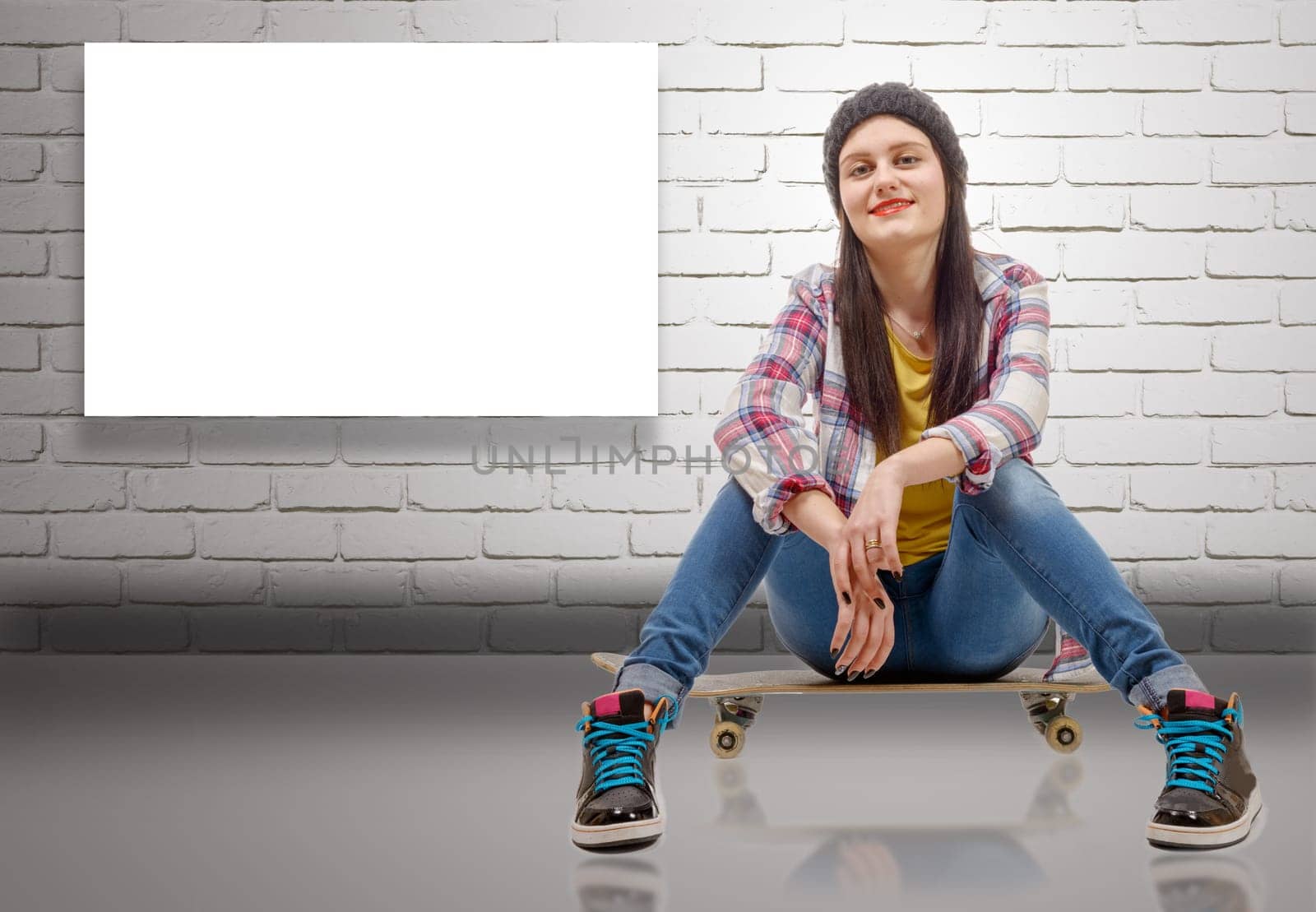 a beautiful young woman posing with a skateboard, seat on skate
