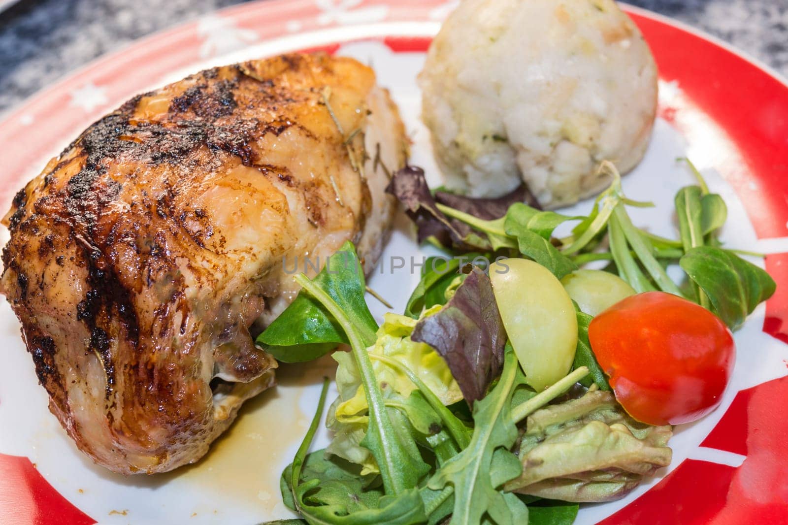 Salad with fried duck breast and potato dumplings.