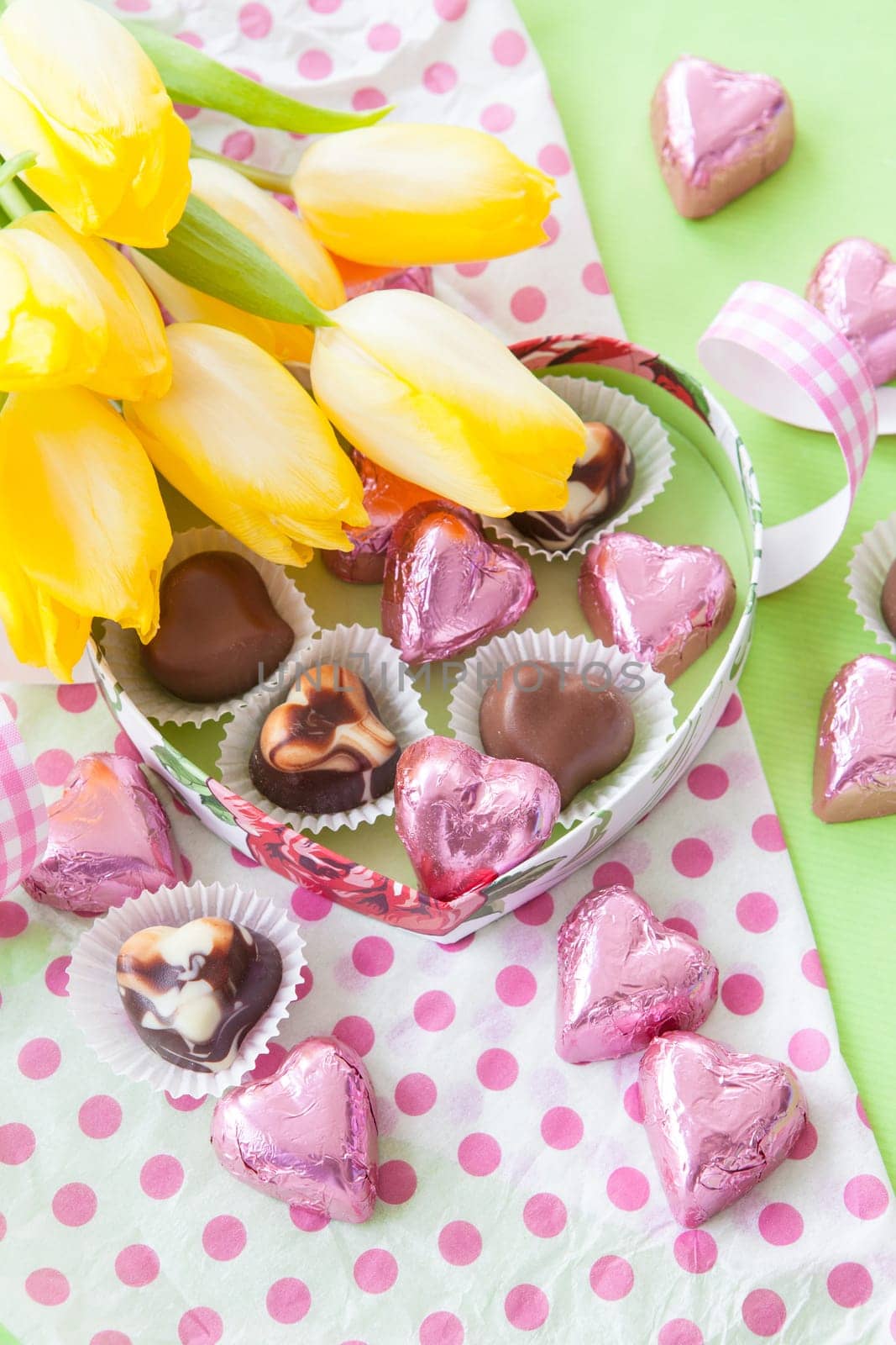 Chocolate box with hearts of chocolate in pink