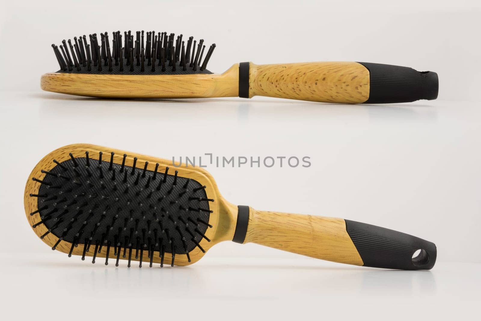 Front and left view of hair brushes isolated on white background.