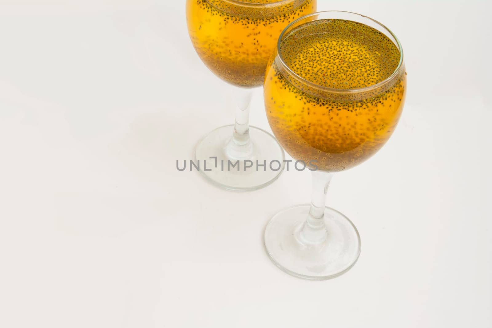 Two Glass of Saffron juice Isolated On White Background