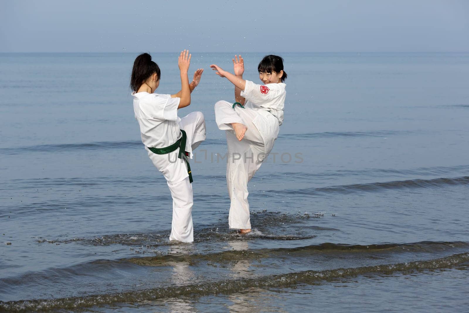 KAGAWA, JAPAN - Jan 3: Japanese karate girls training of karate in midwinter of a new year at Ichinomiya Beach, January 3, 2016, Kagawa, Japan