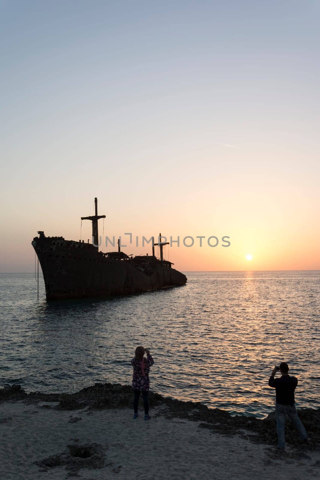 Taking Photos By Cell phones From Greek Ship Wreckage in Kish Island at Sunset