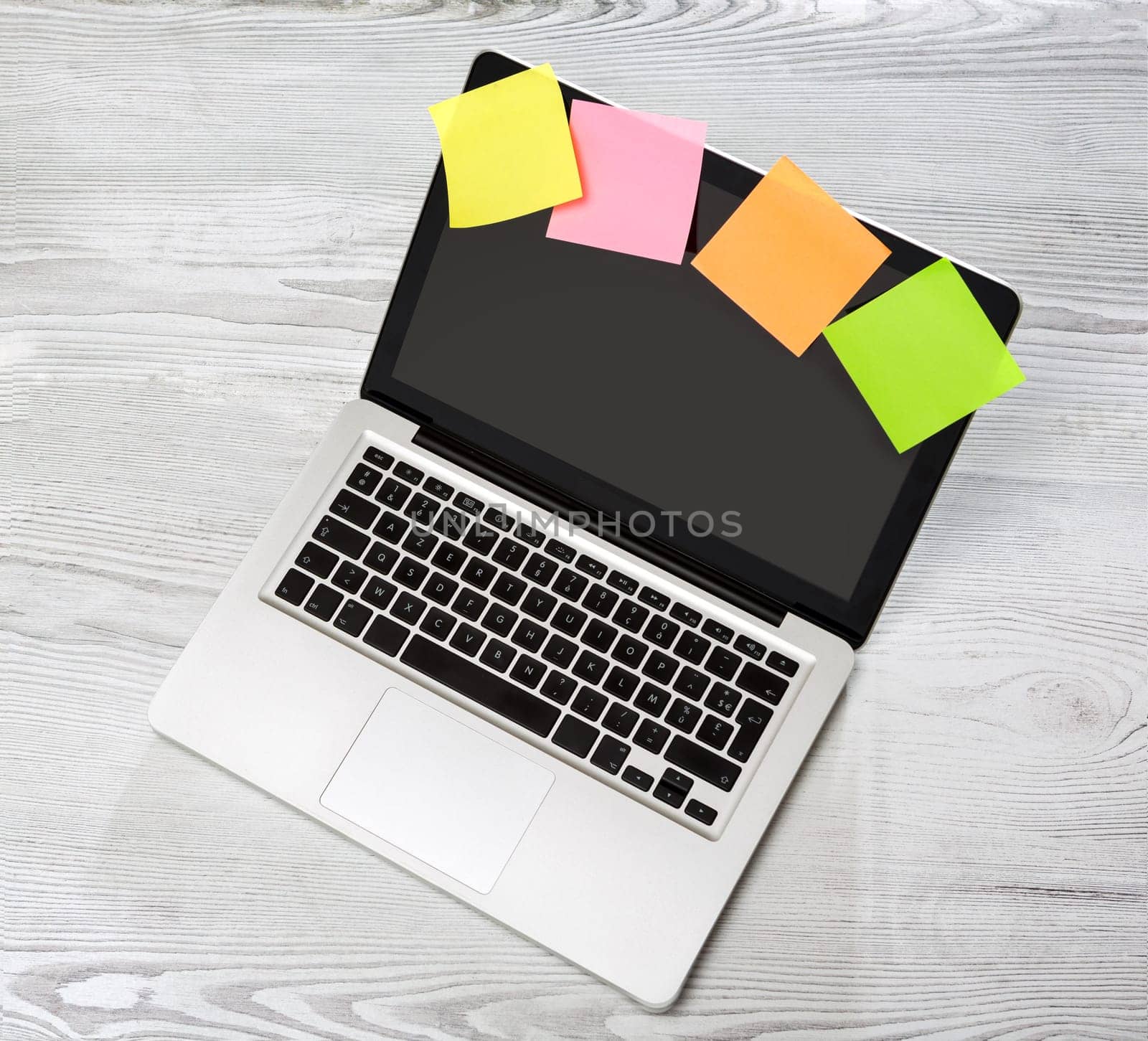 View of a Lapotop in high definition on a wood background