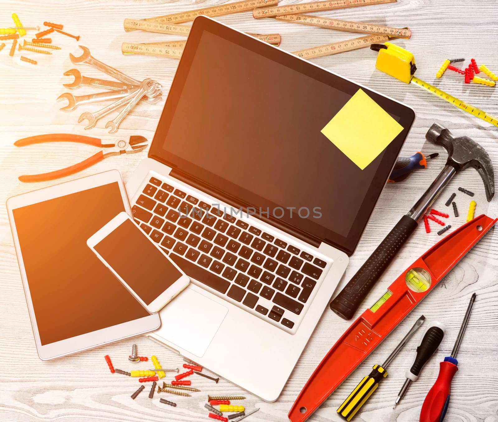 View of a Wood handyman's desk in high definition with laptop, tablet and mobile