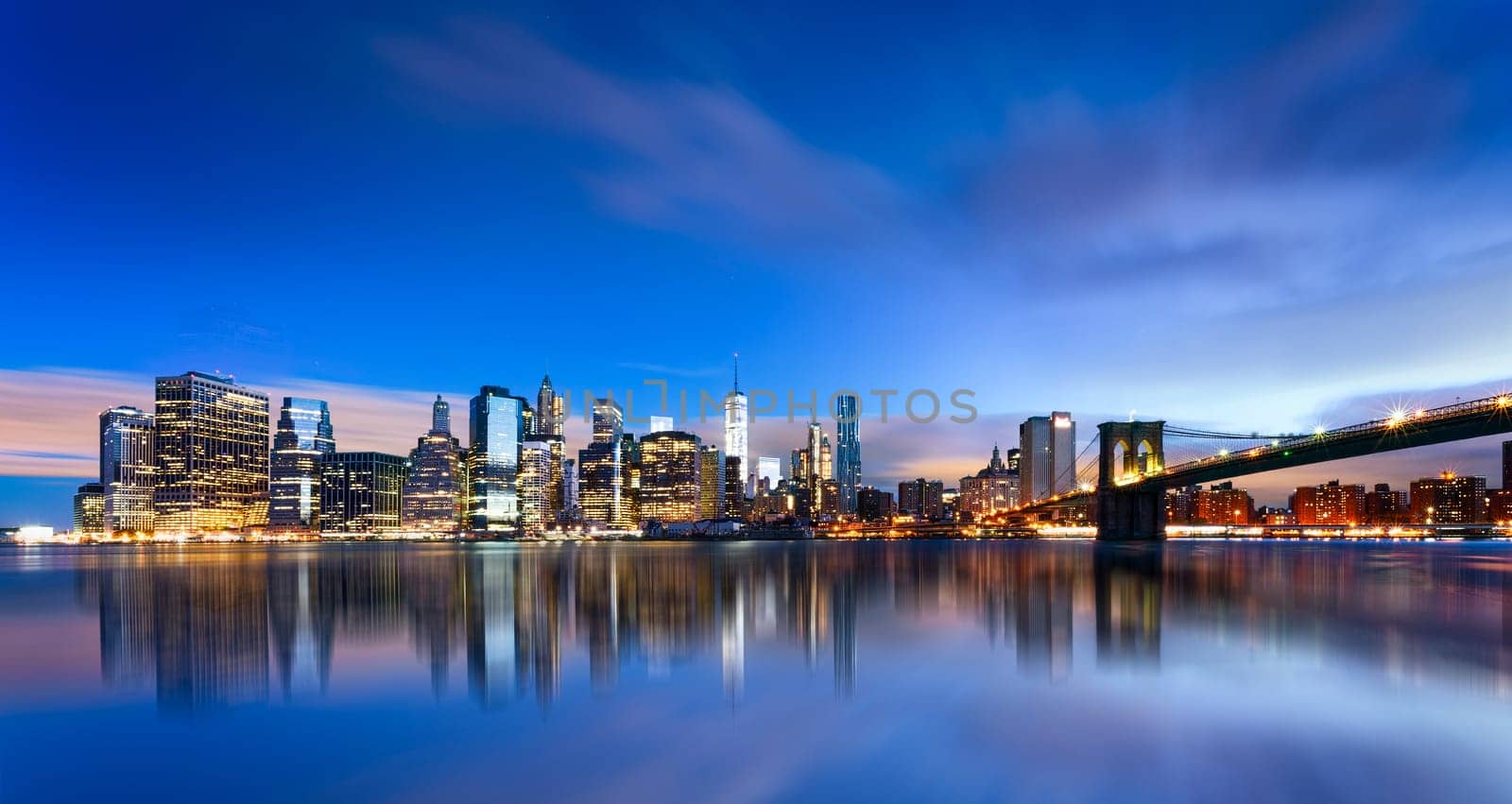 New York City - beautiful sunrise over manhattan with manhattan and brooklyn bridge USA
