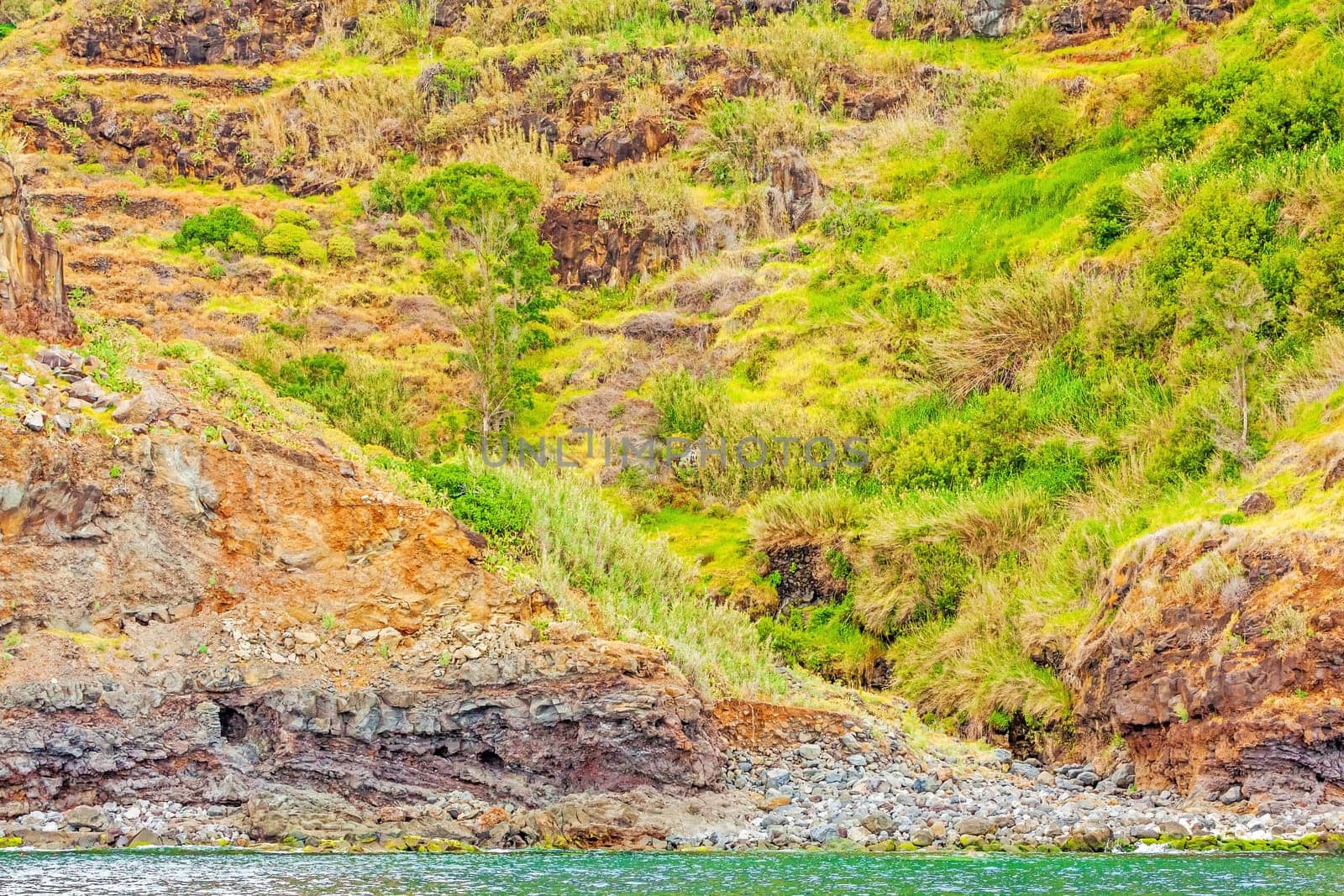Colorful rocky cliff coast of Madeira between Jardim do Mar and Calheta