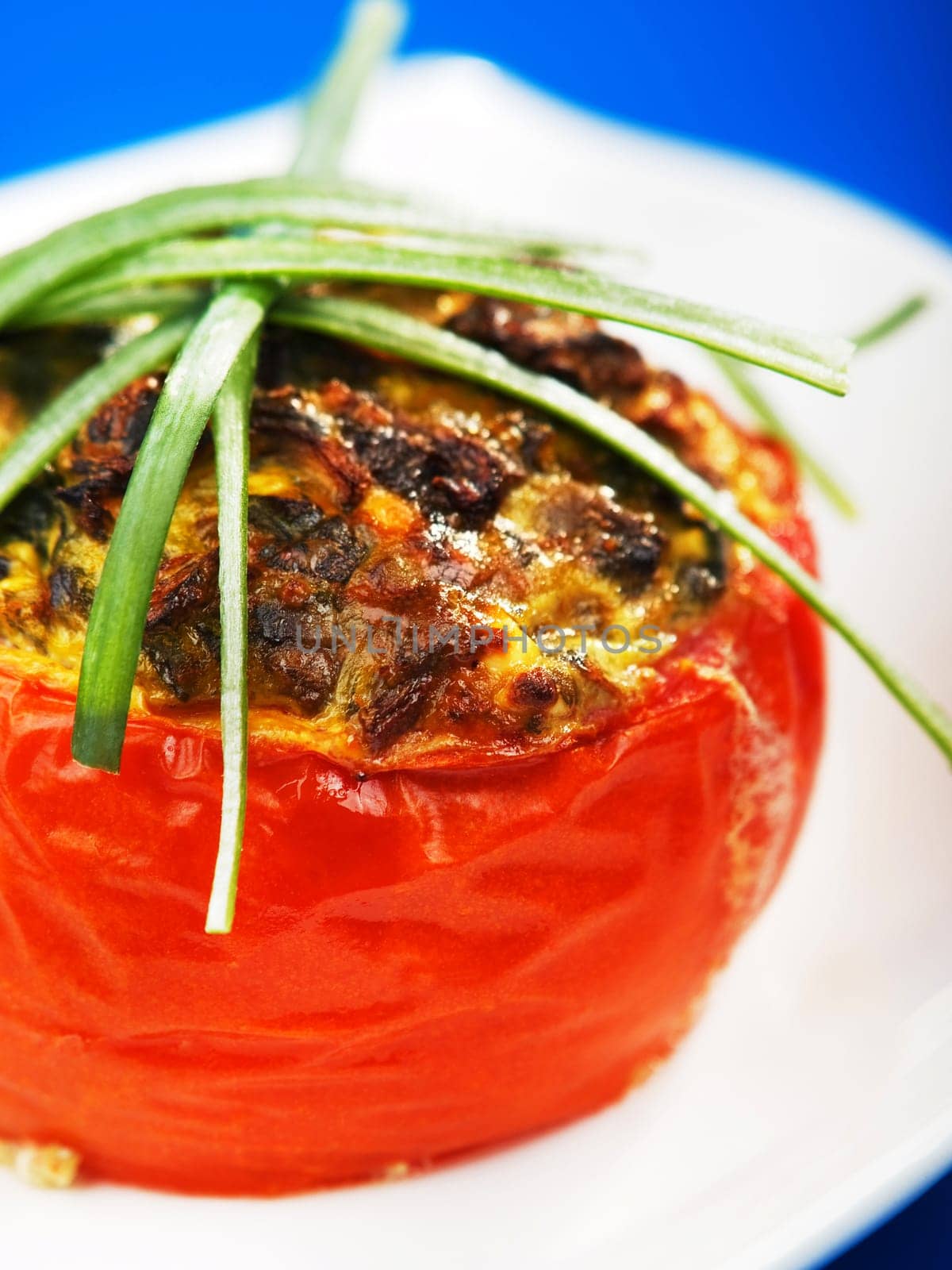 Stuffed tomato with spinach, eggs and cheese