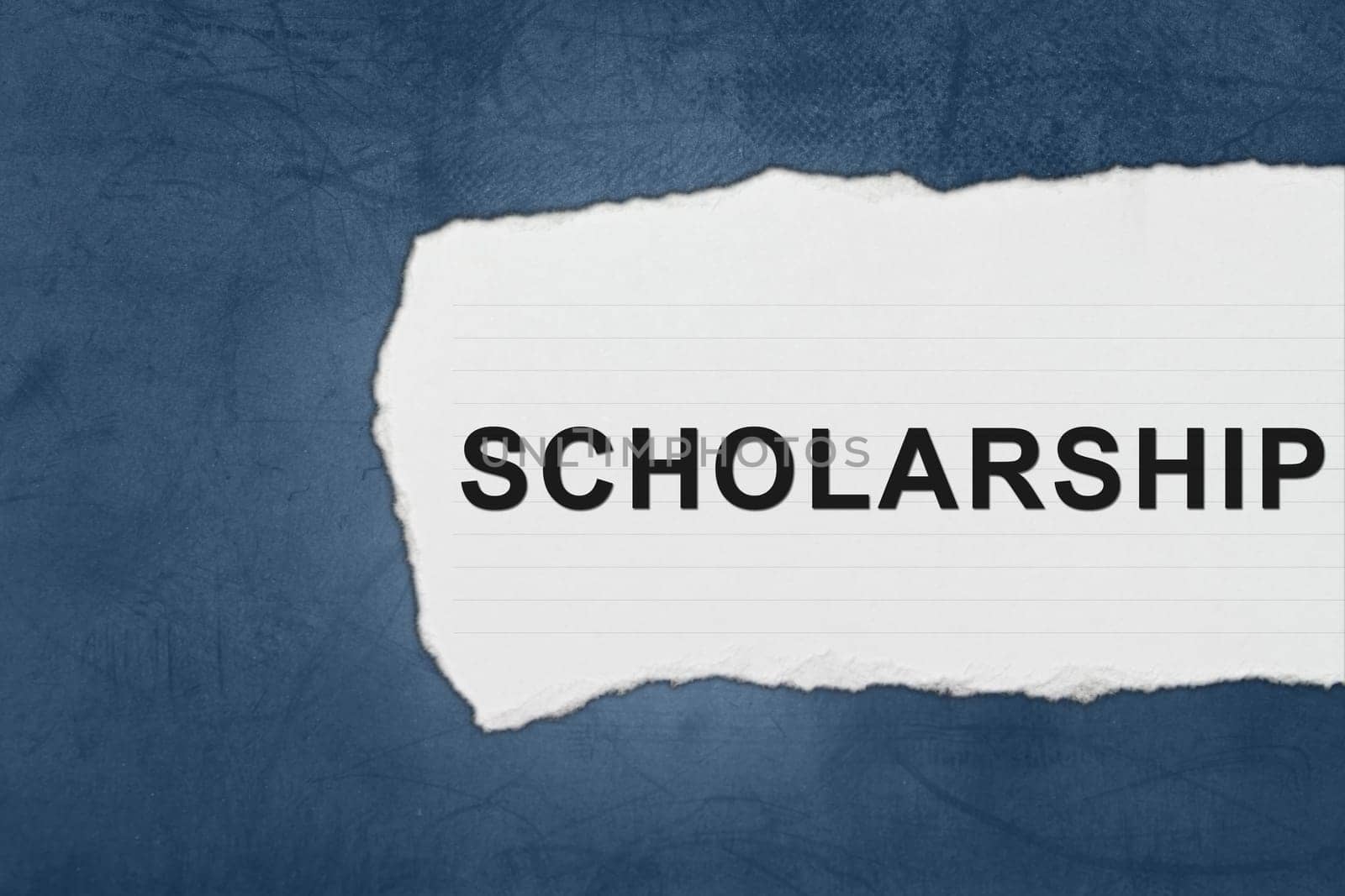 scholarship with white paper tears on blue texture