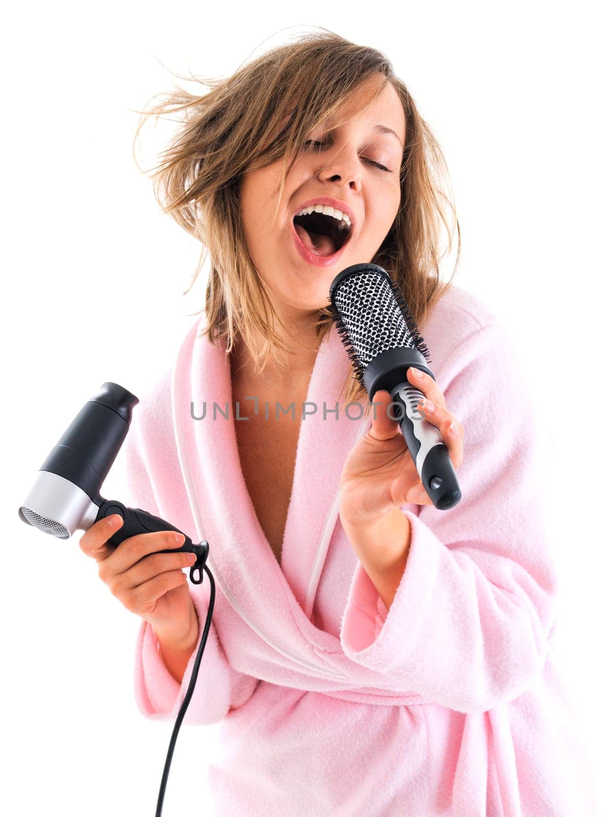 Woman singing with hairbrush