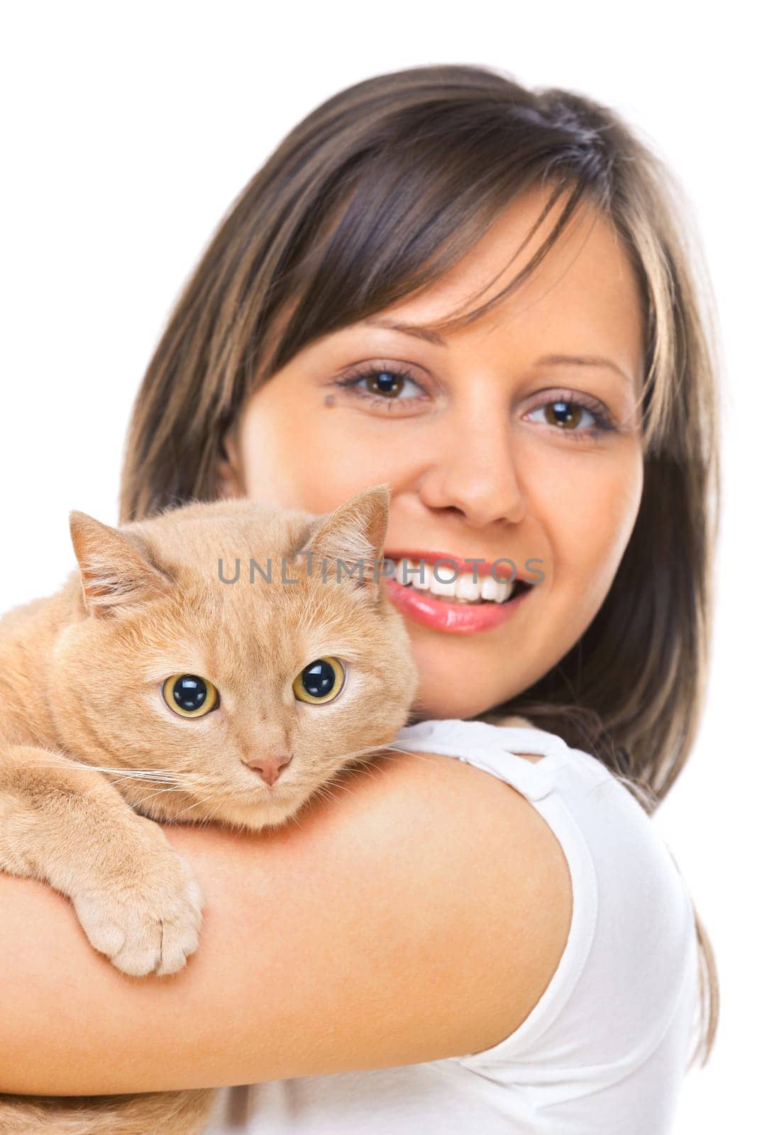 Young woman posing at camera with redhaired domestic cat