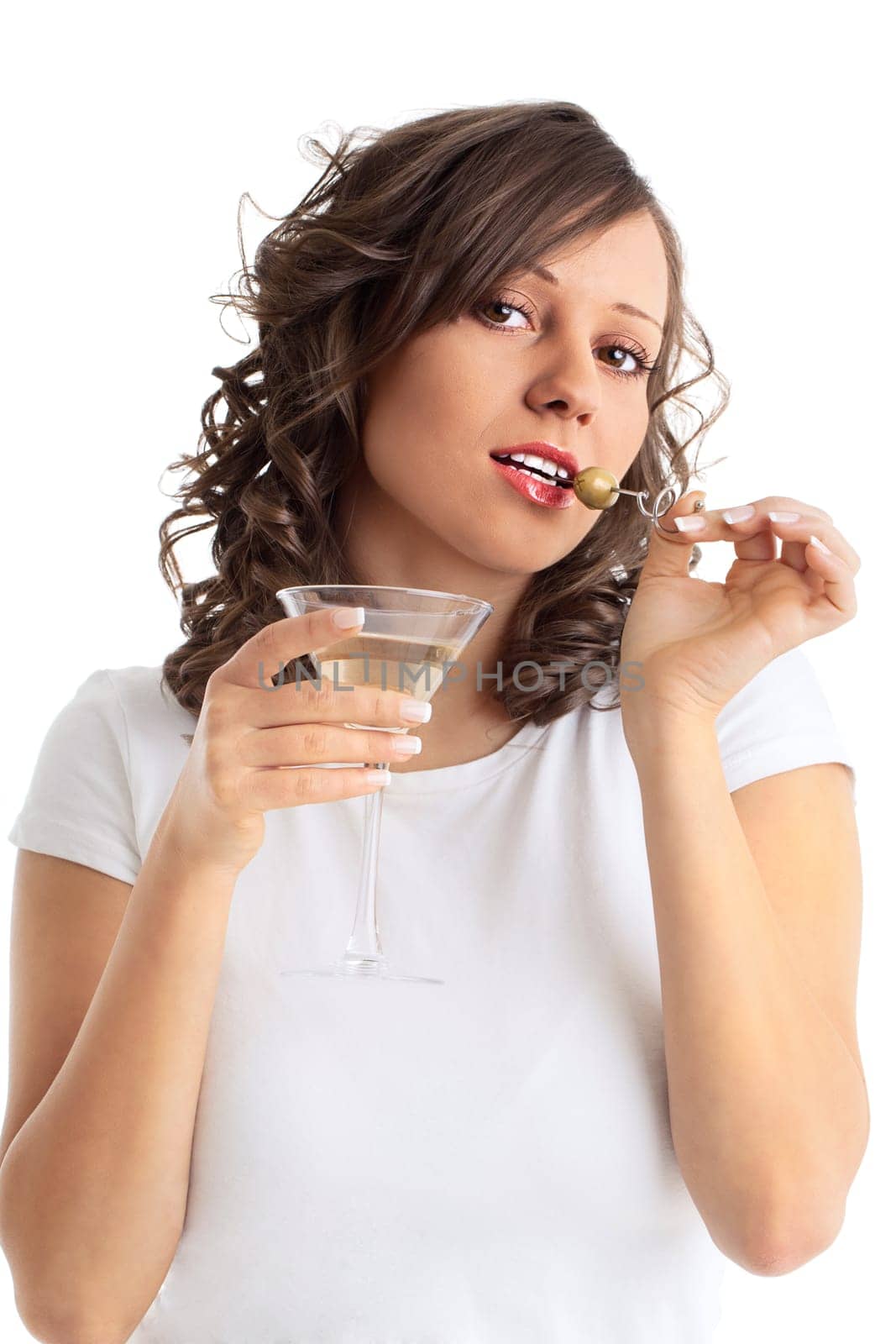 Young woman eating cherry from a chocolate cake, isolated on white