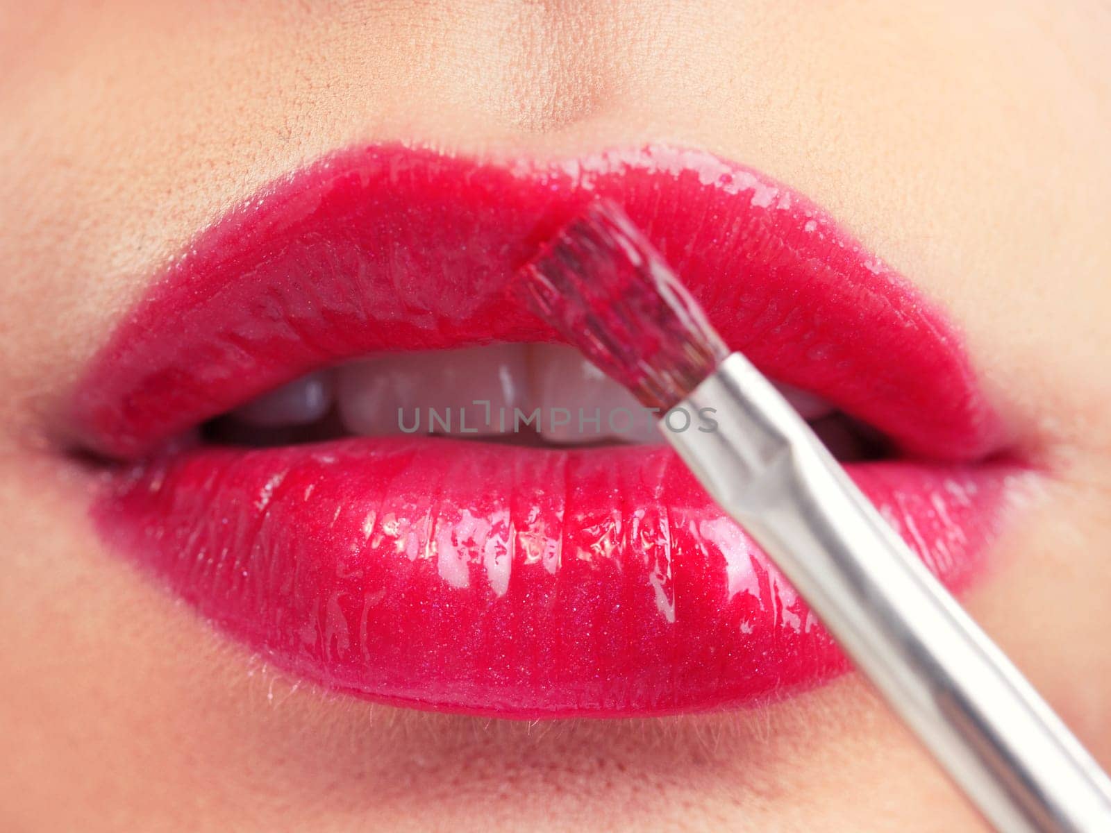 Attractive woman lips with red lipstick, close up