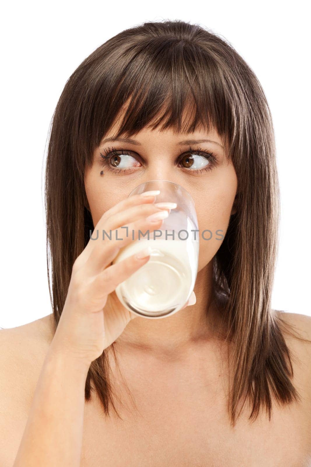Woman drinking milk looking at camera, isolated on white background with copy space
