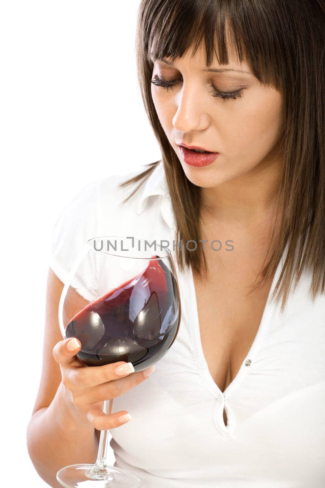 Young woman drinking red wine isolated on white background