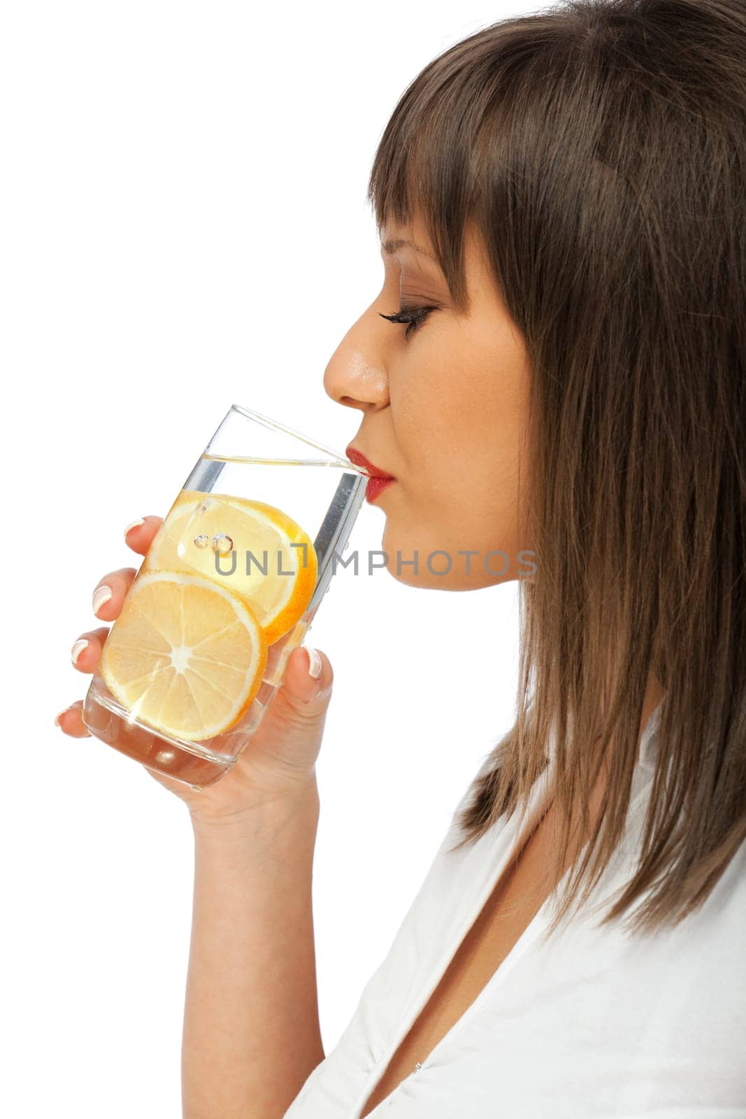 Woman drinking water with lemon, side view, isolated on white background with copy space