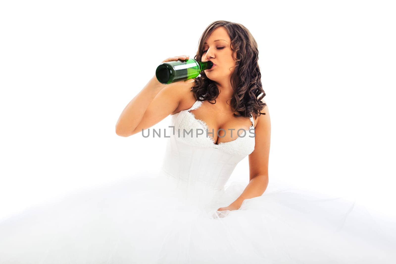 Young bride drinking beer isolated on white background