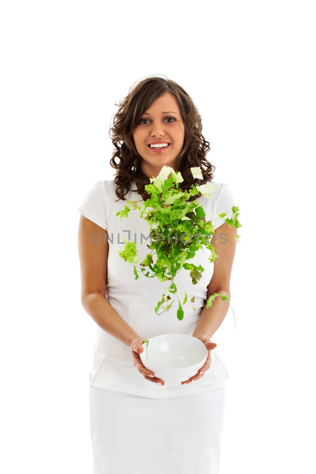 Young woman jumping with healhty salad isolated on white background
