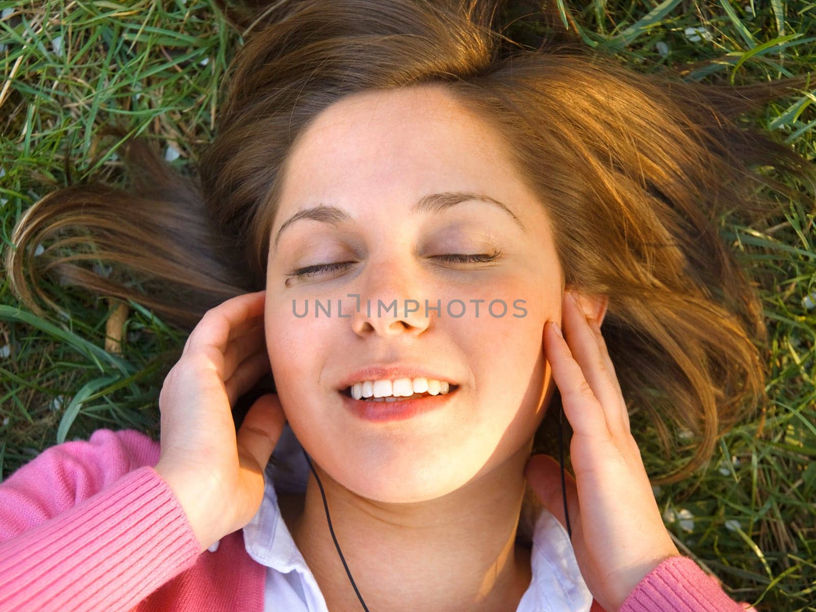 Woman lying on grass