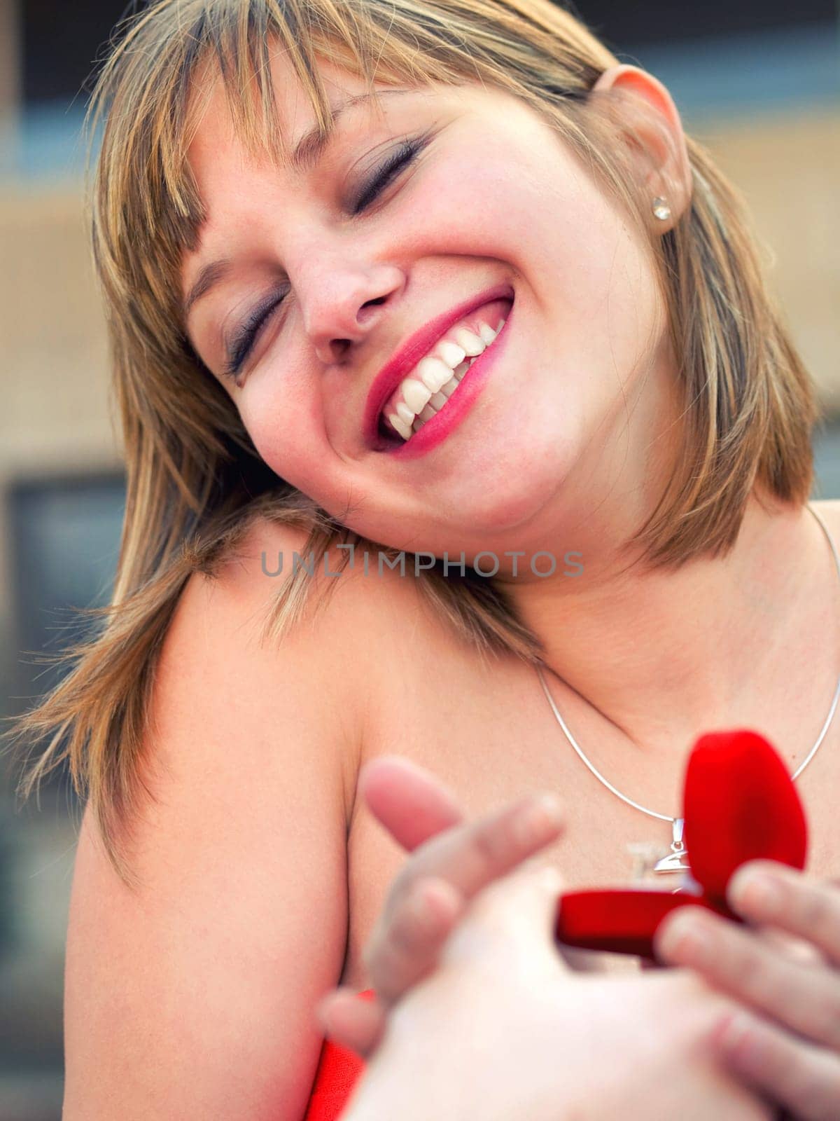 Happy woman with engagement ring