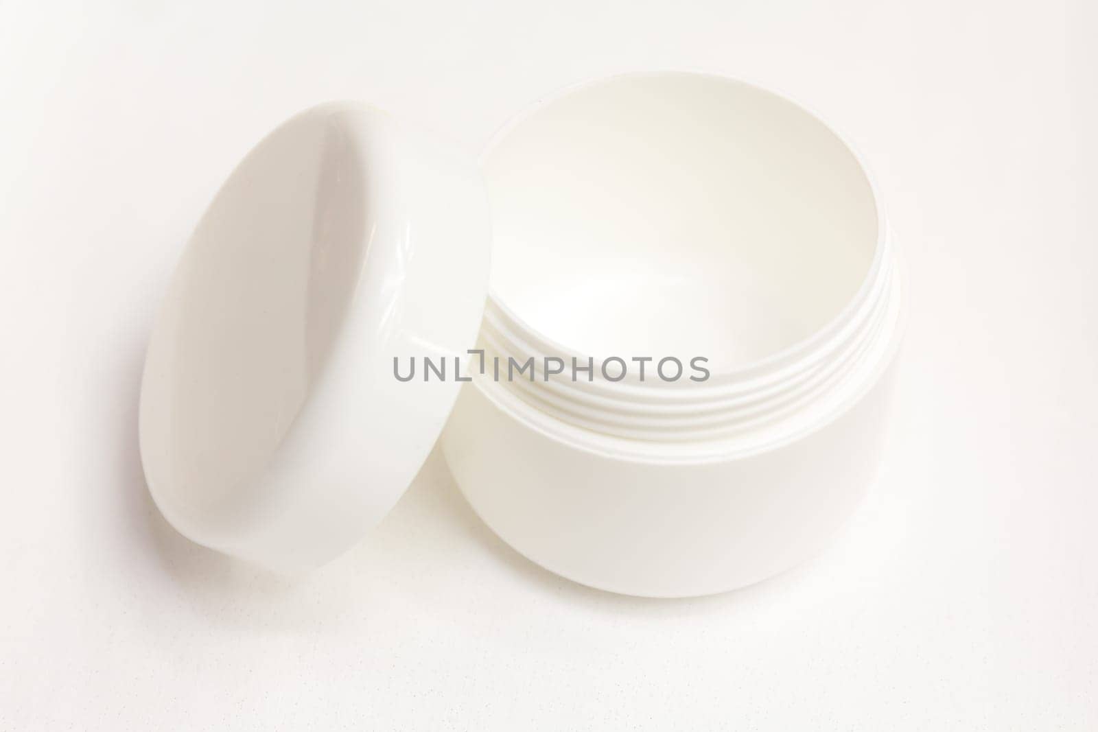 A cream can insulated against a white background