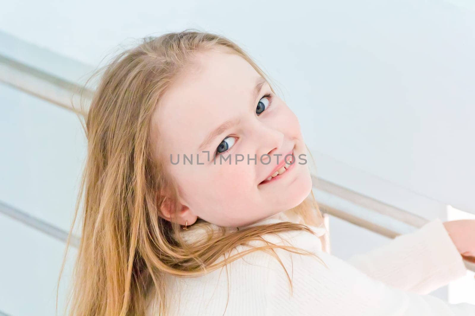 Portrait of cute girl with blond hair