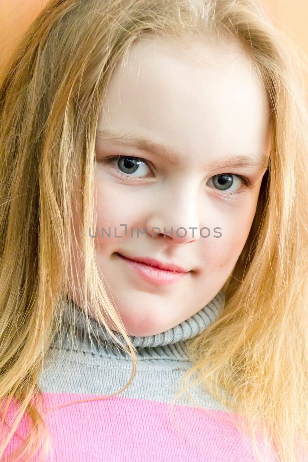 Portrait of cute girl with blond hair