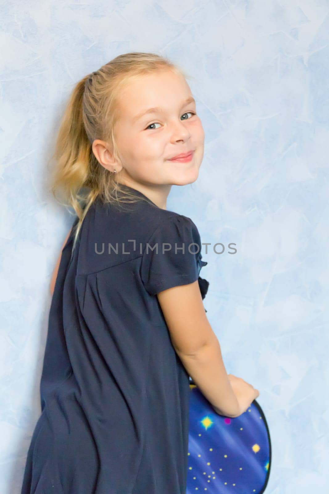 Portrait of cute girl with blond hair
