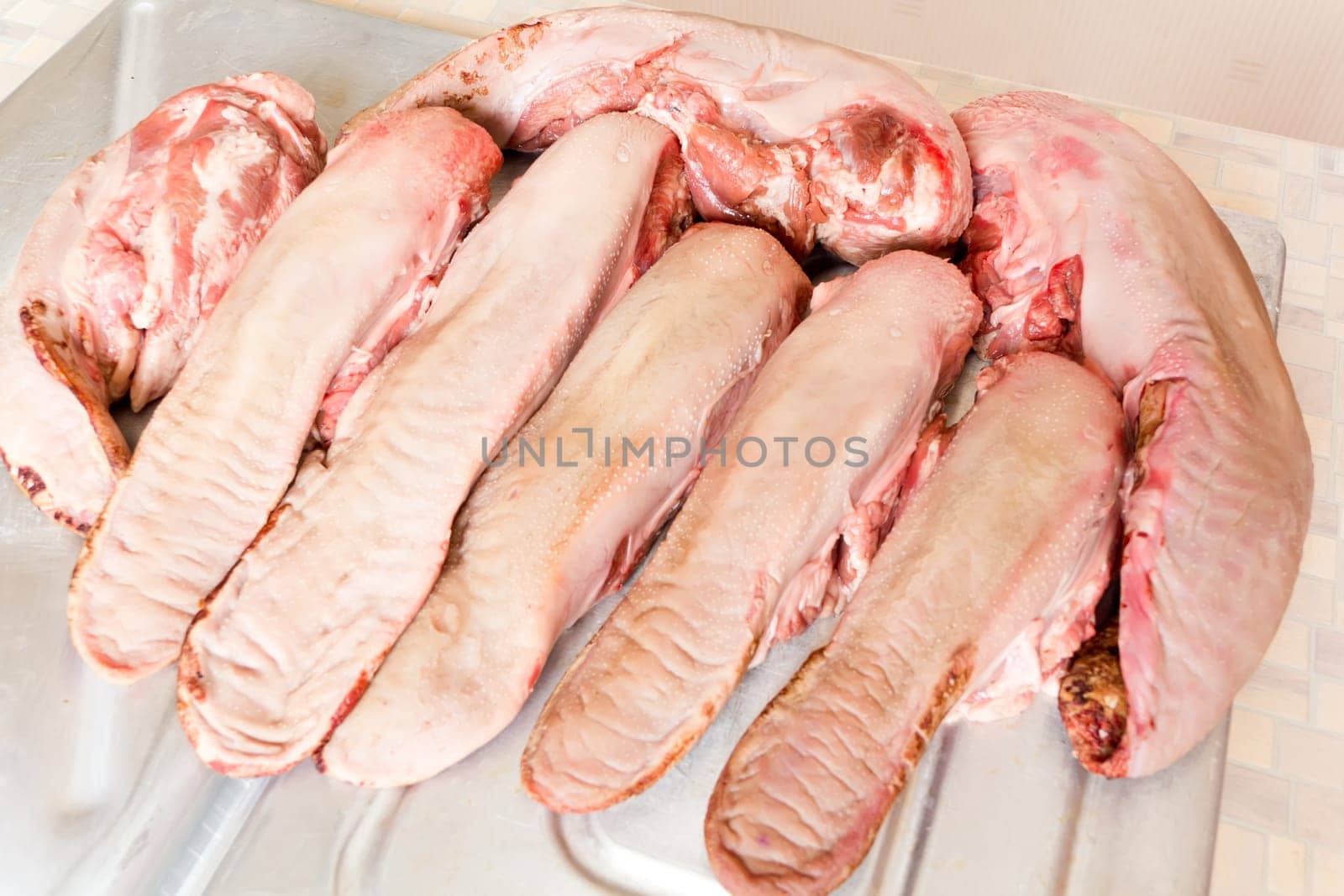 Photo of raw pork tongue in the market place
