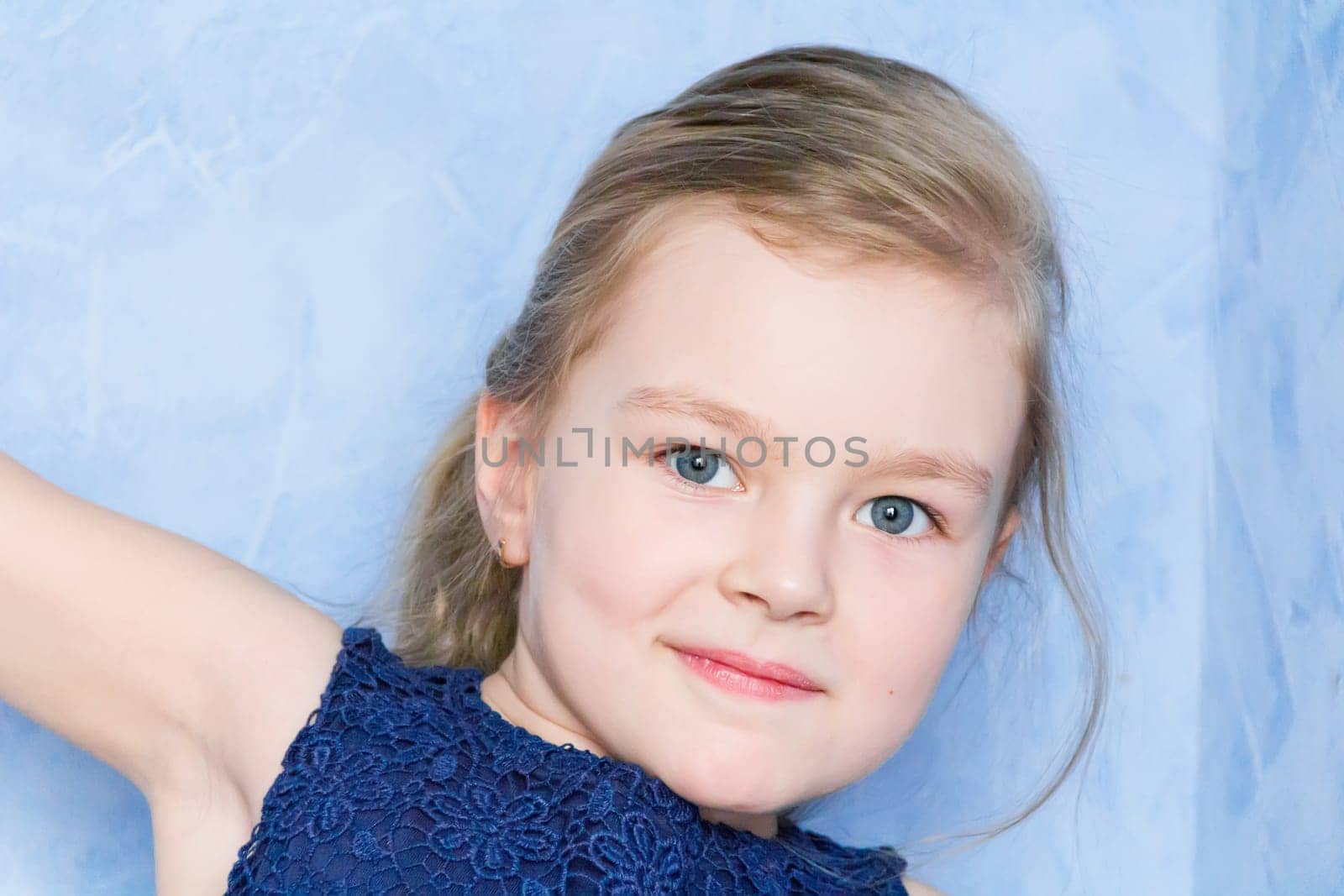 Portrait of cute girl with blond hair