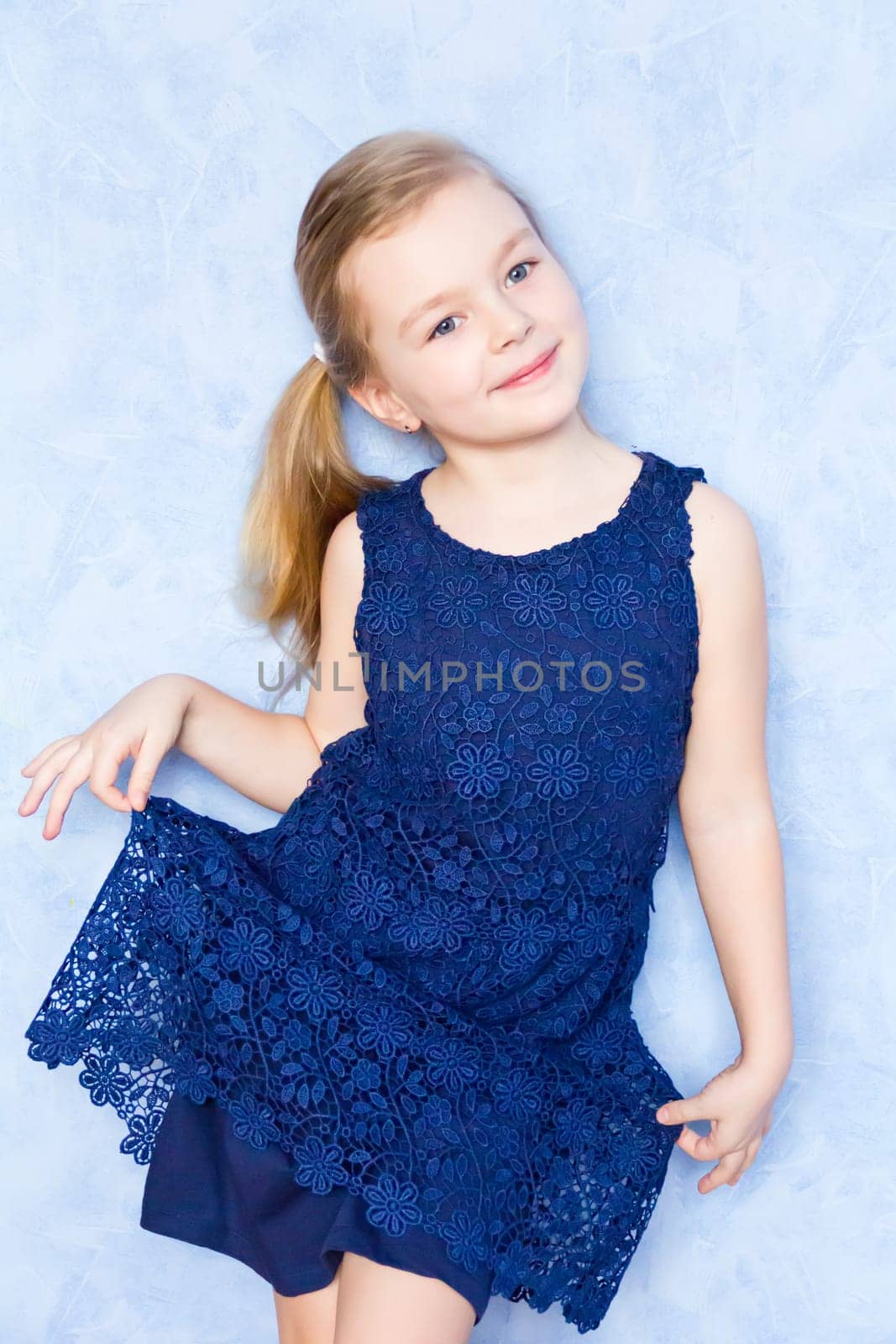Portrait of cute girl with blond hair