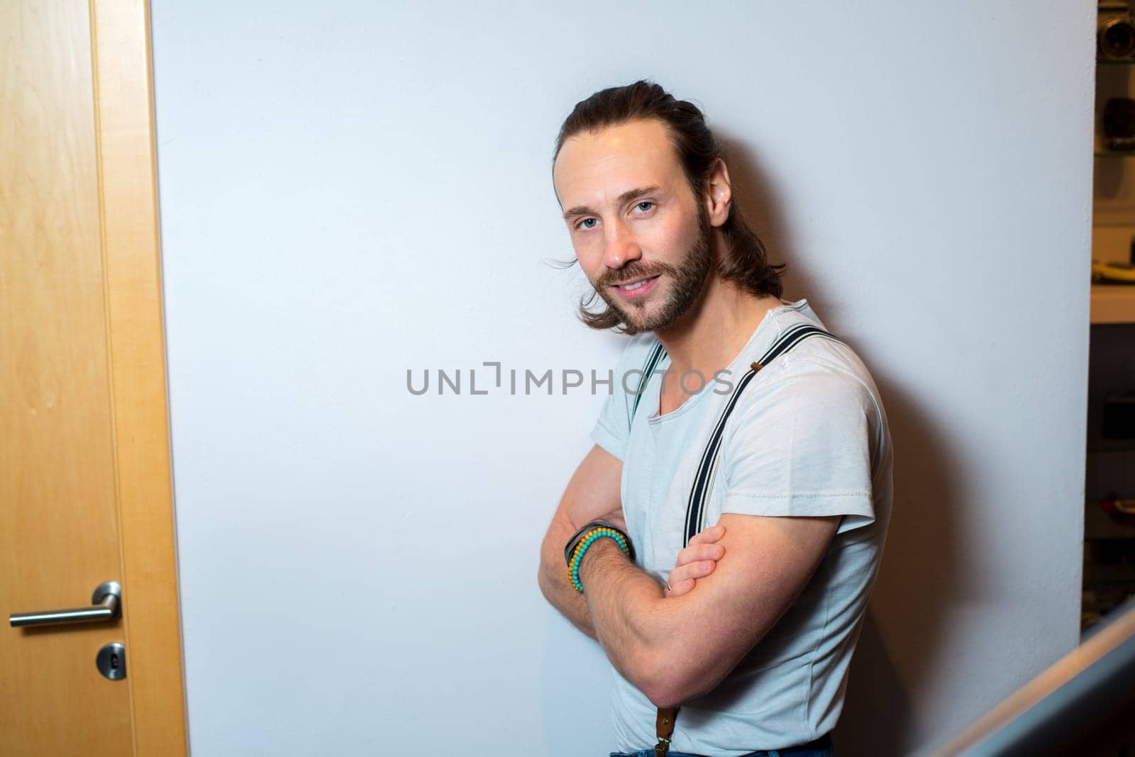 young bearted man lokking friendly in to the camera