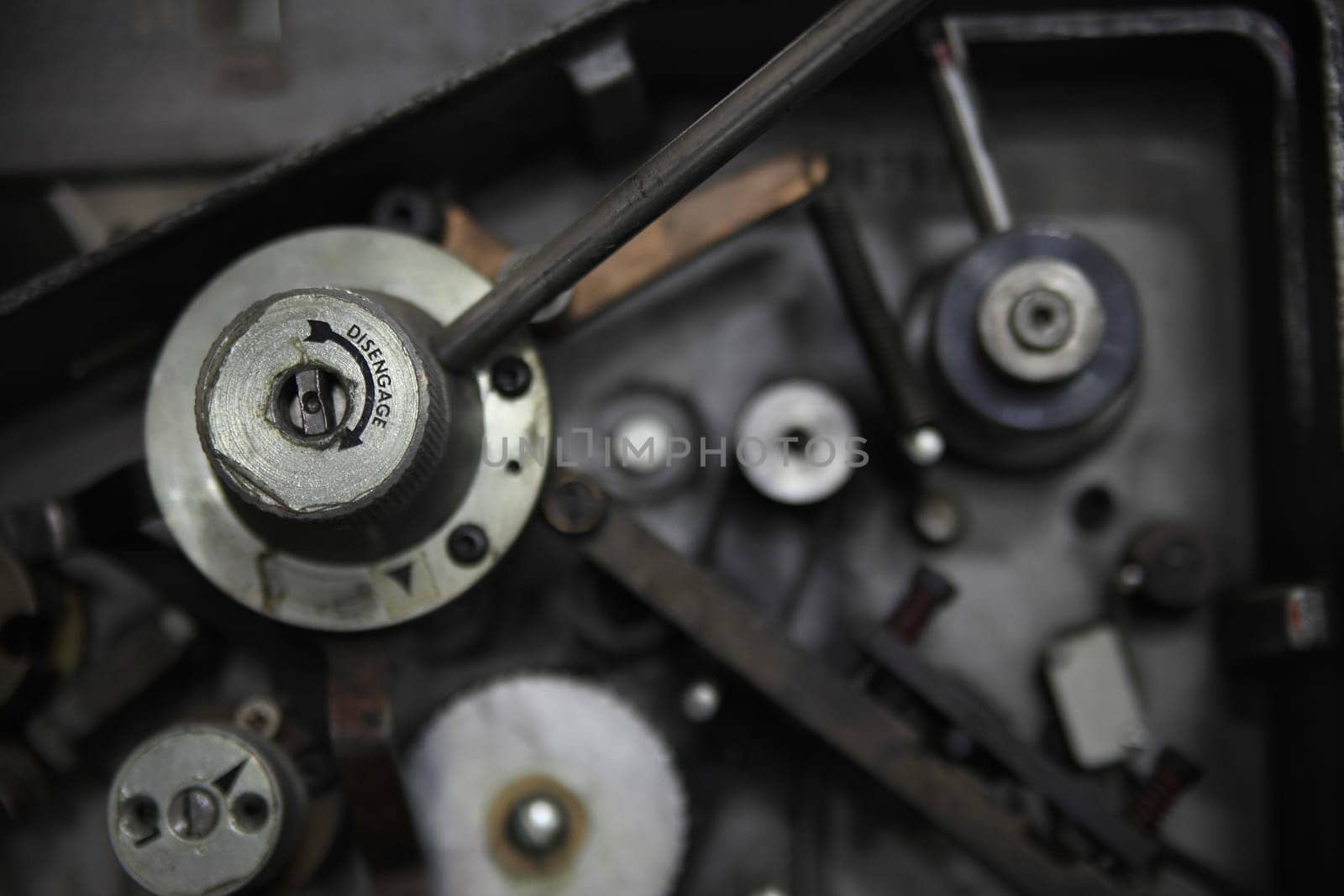 Machine part with the word 'disengage' and an arrow