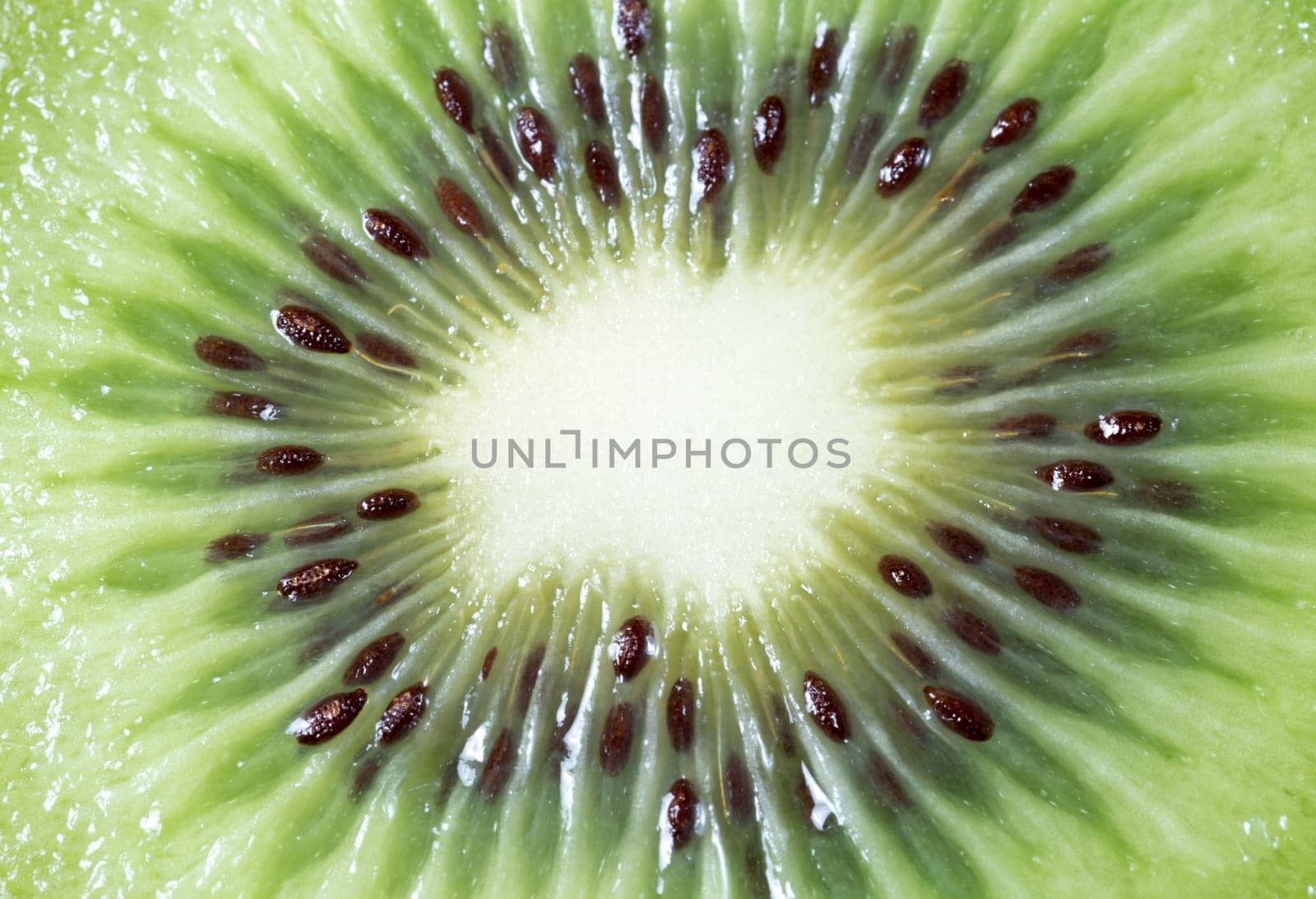 Center of a Sliced Kiwifruit close up macro image.