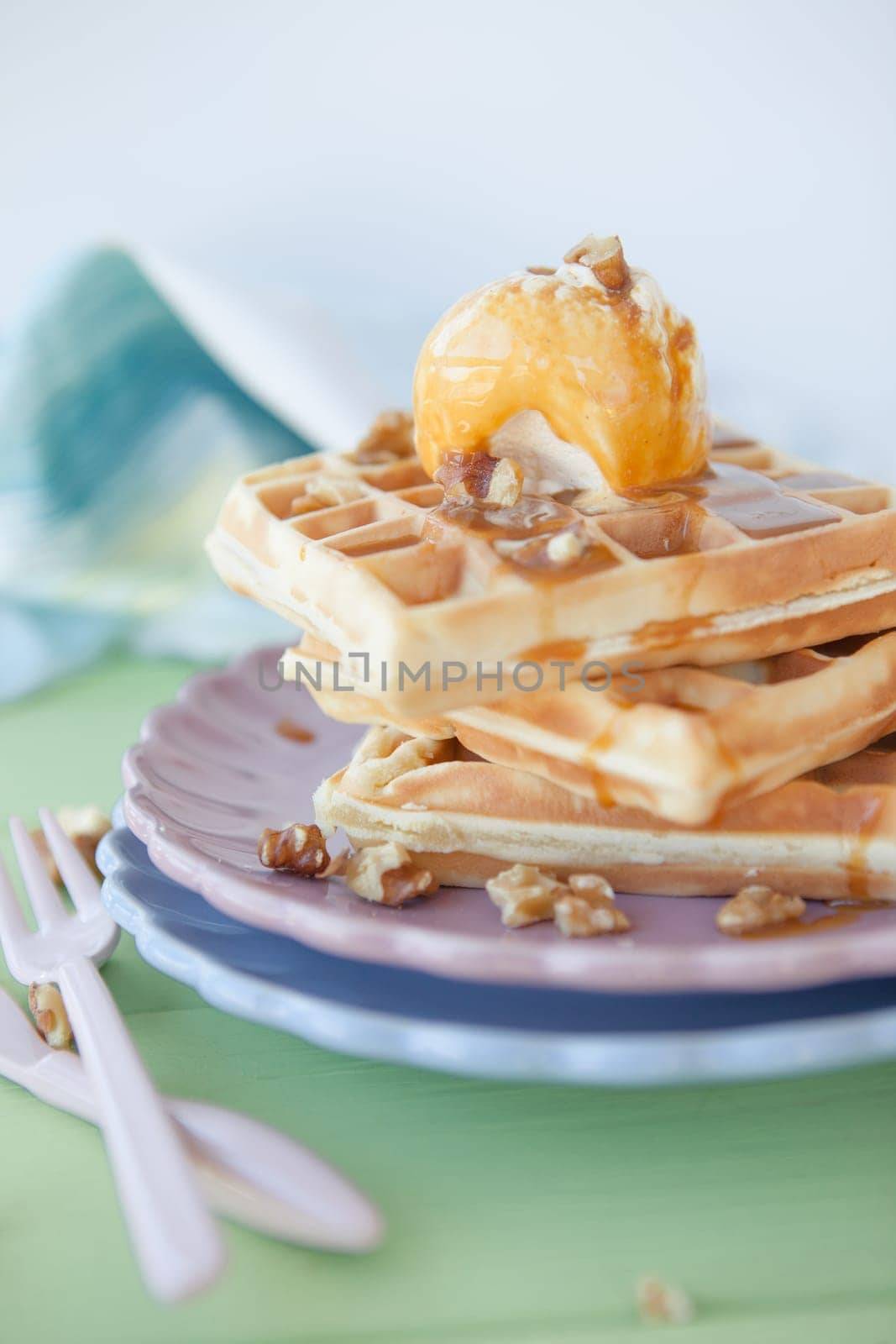 Waffles with vanilla ice cream ,caramel and walnuts