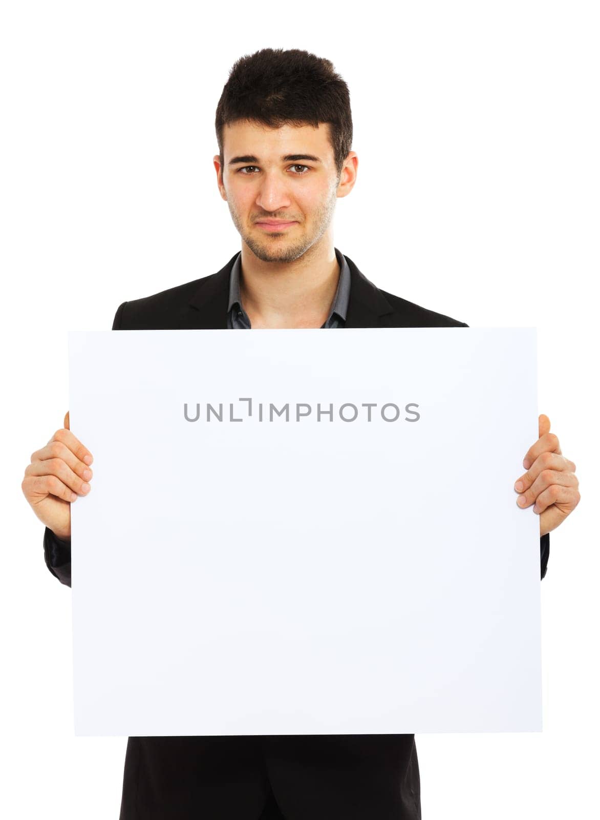 Young businessman holding blank board and looking at the camera. Isolated on white background