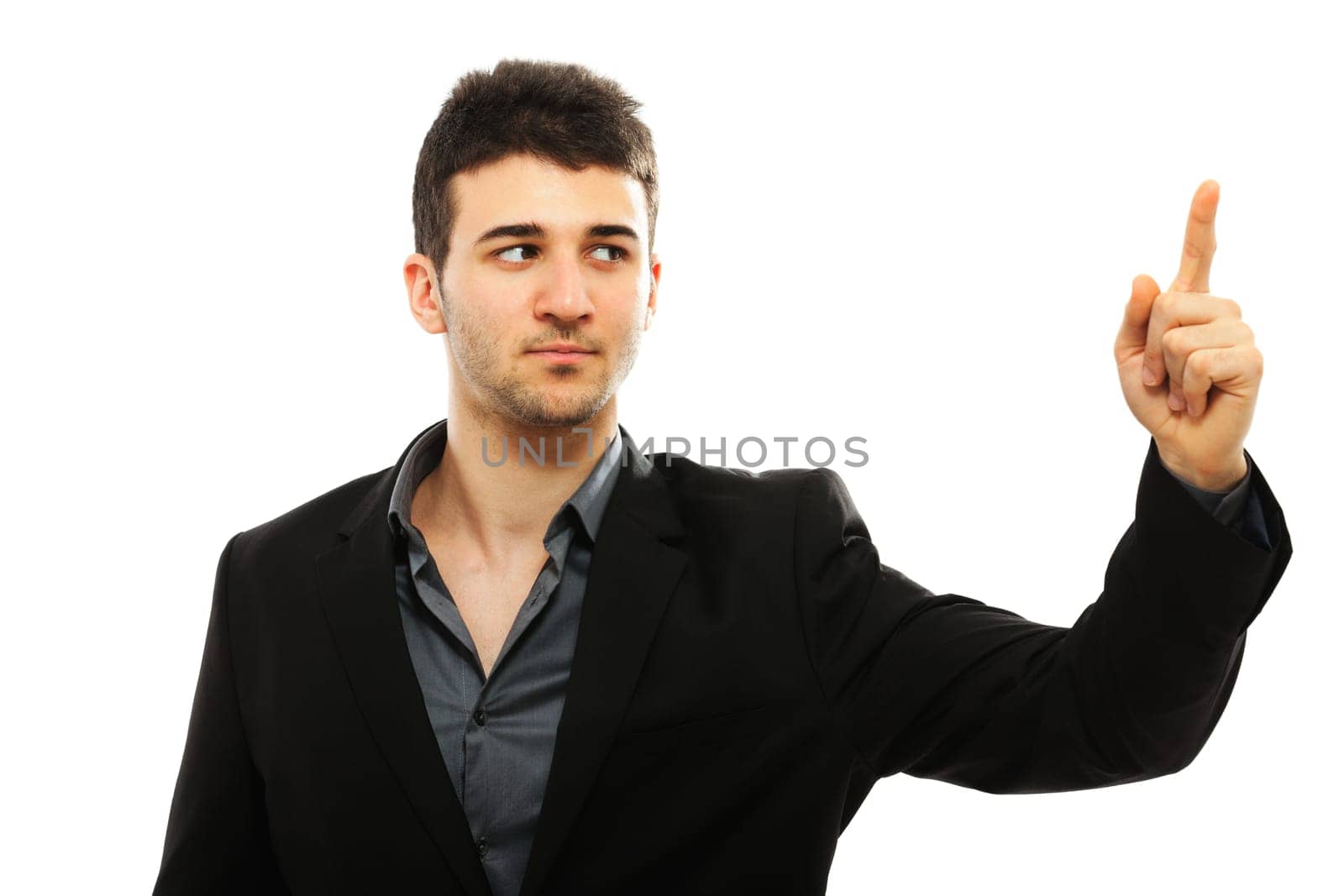 Young businessman pointing with his left hand, isolated on white