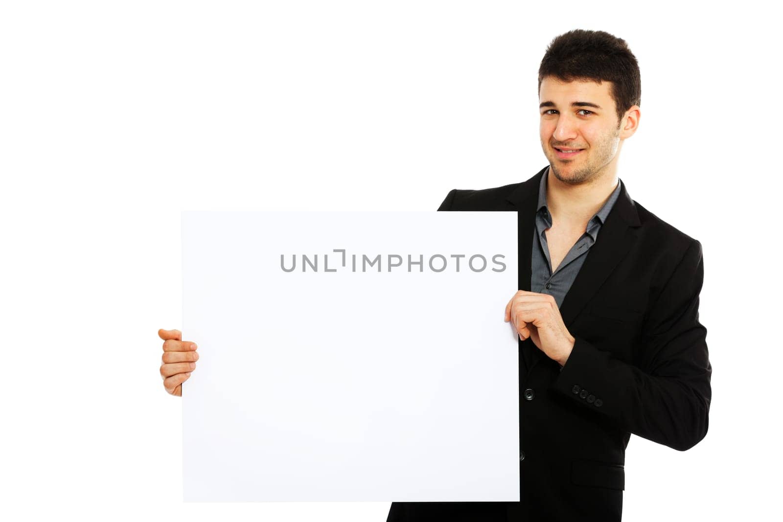 Young smiling businessman holding blank board isolated on white background