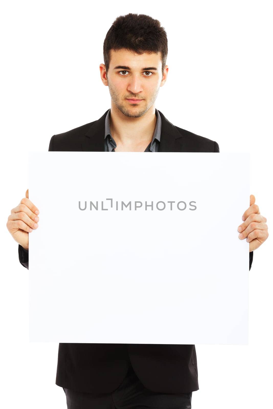 Young businessman holding blank board isolated on white background
