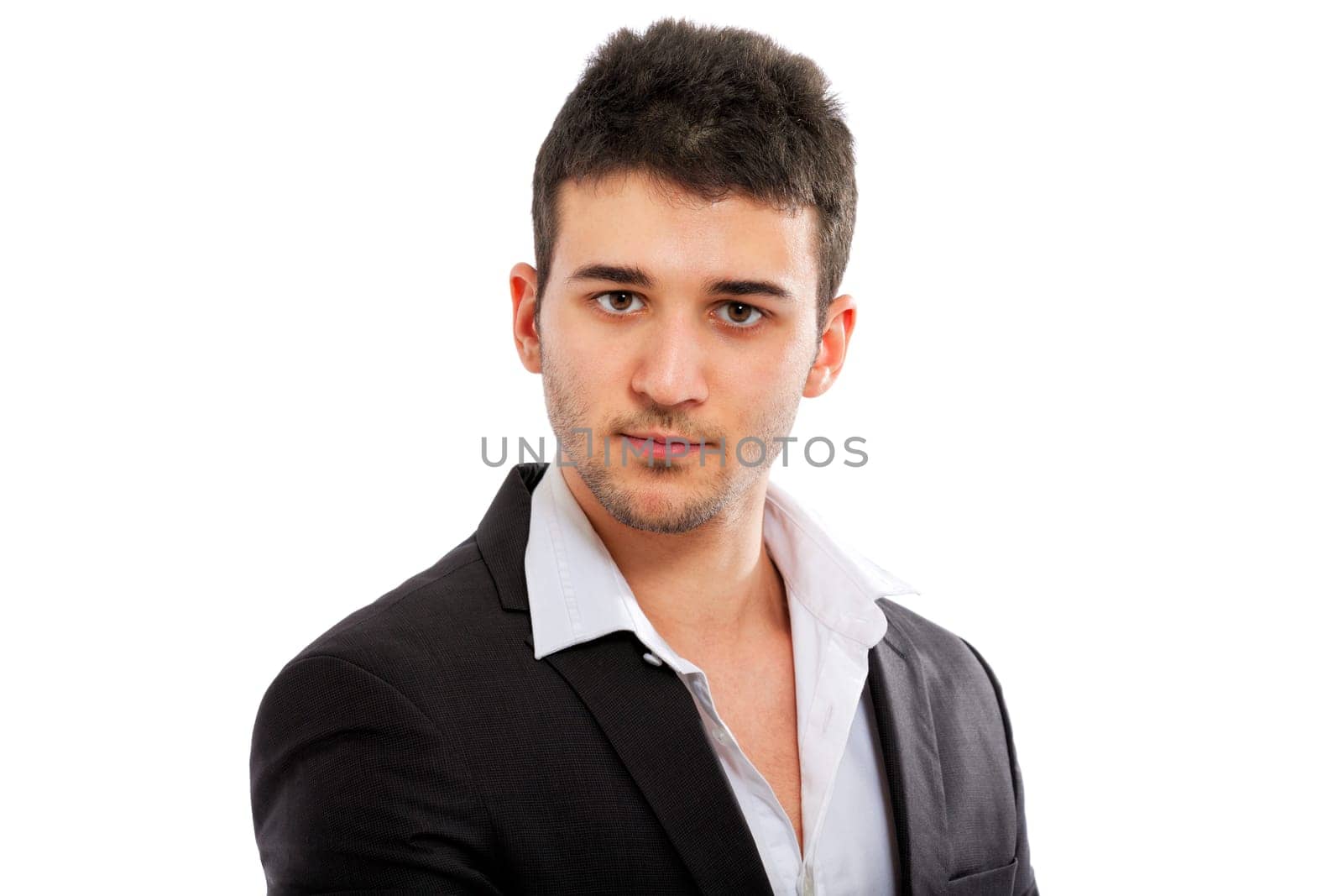 Young businessman portrait isolated on white background. Staring at the camera.