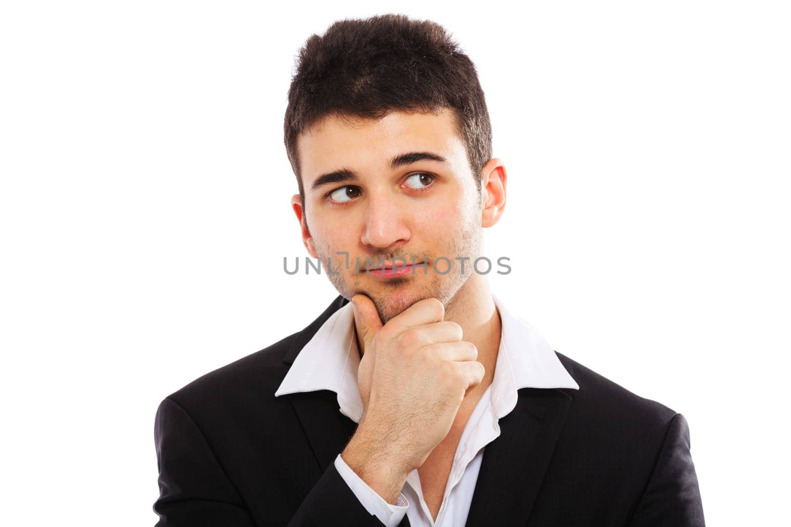 Young businessman portrait isolated on white background. Hand on chin, looking right.