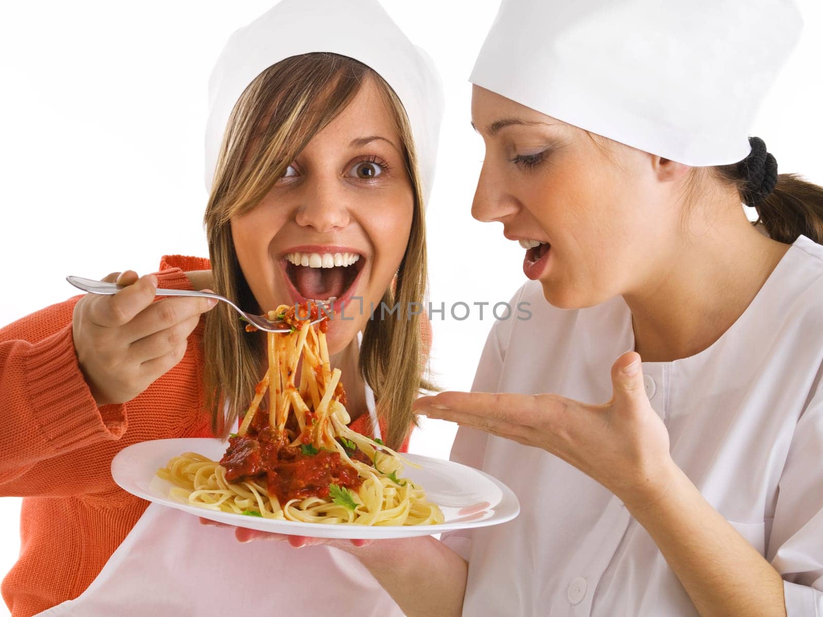Chefs with spaghetti bolognese
