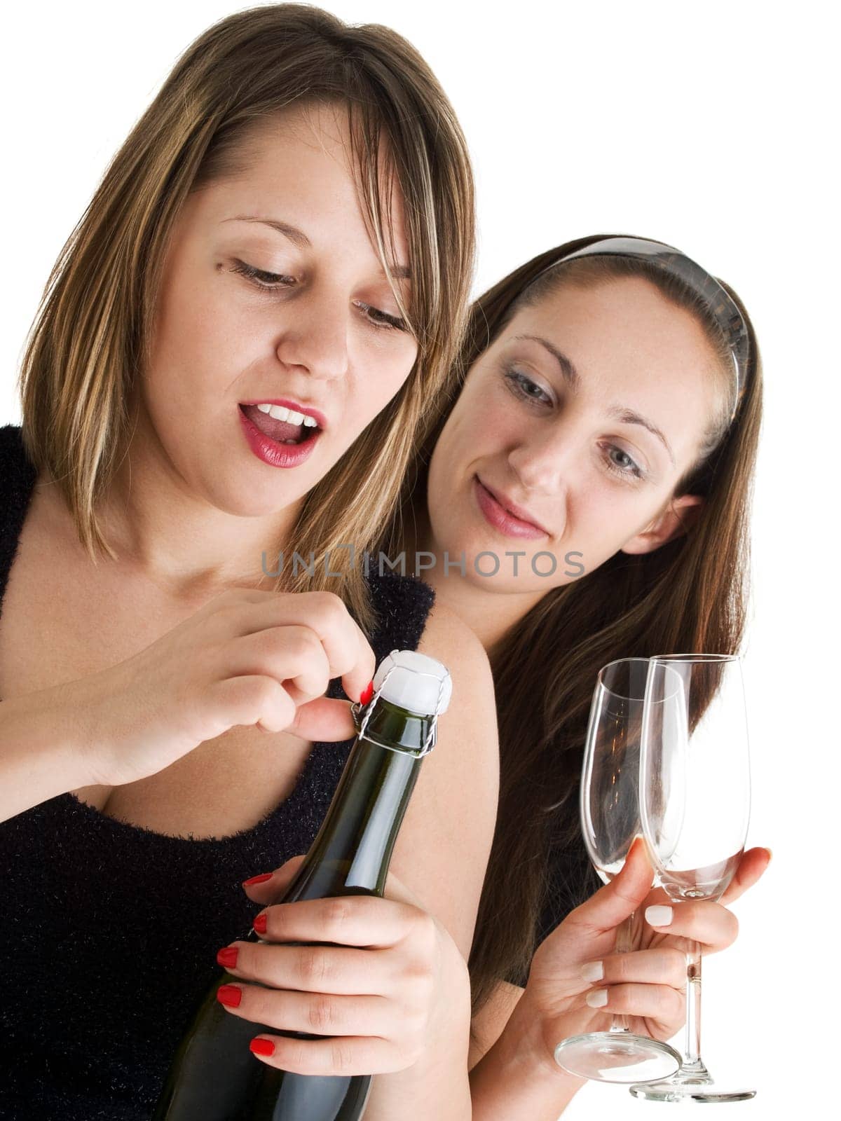 Girls celebrating with champagne isolated on white
