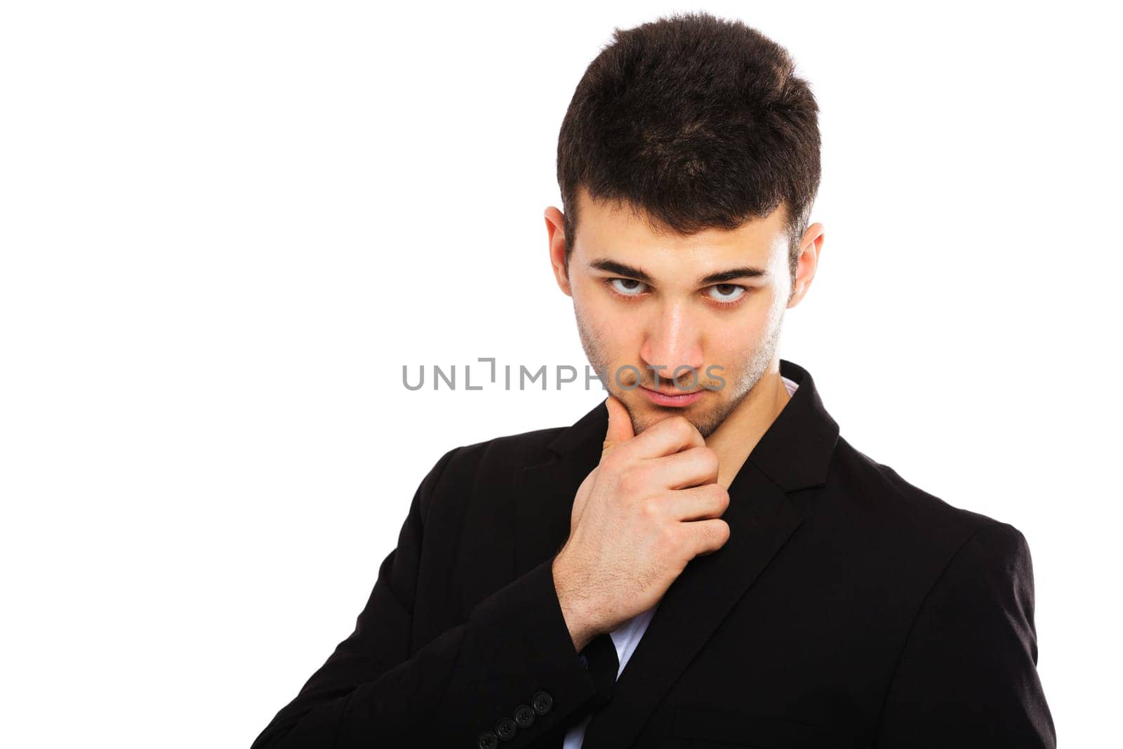 Portrait of a young businessman isolated on white background. Hand on chin.