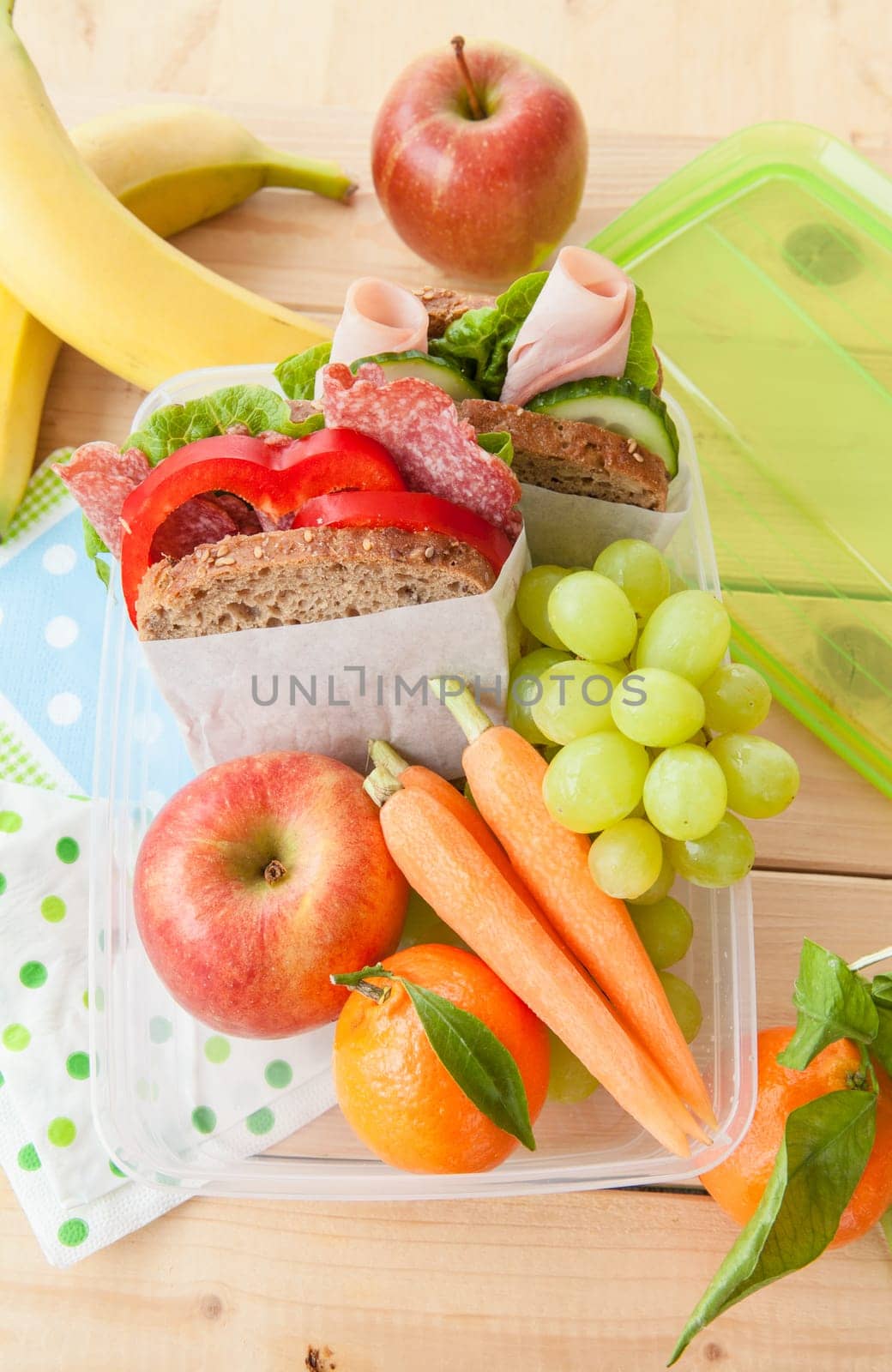 Packed lunch with sandwiches and fruit