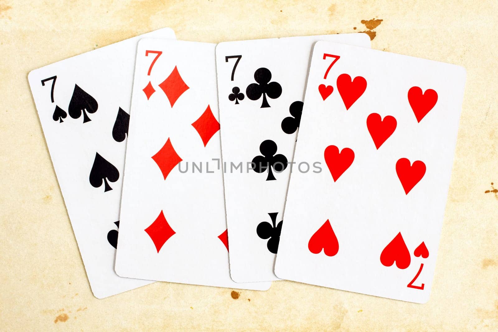 Playing cards - seven (poker), on old paper background