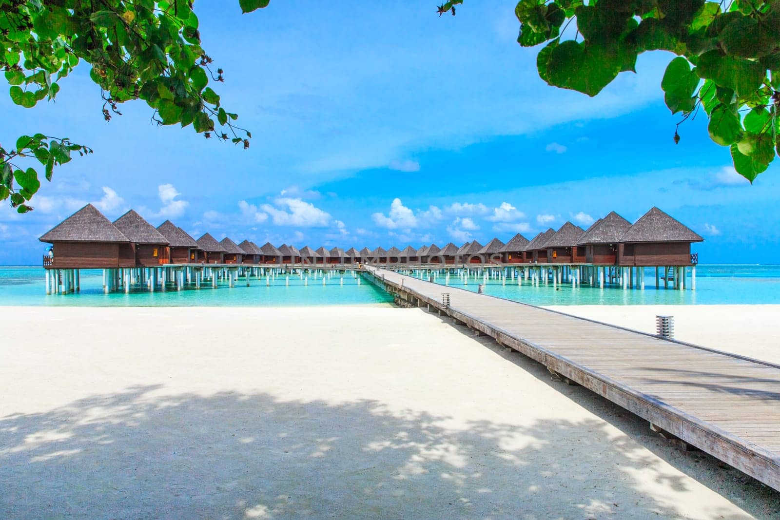 beach with water bungalows at Maldives..