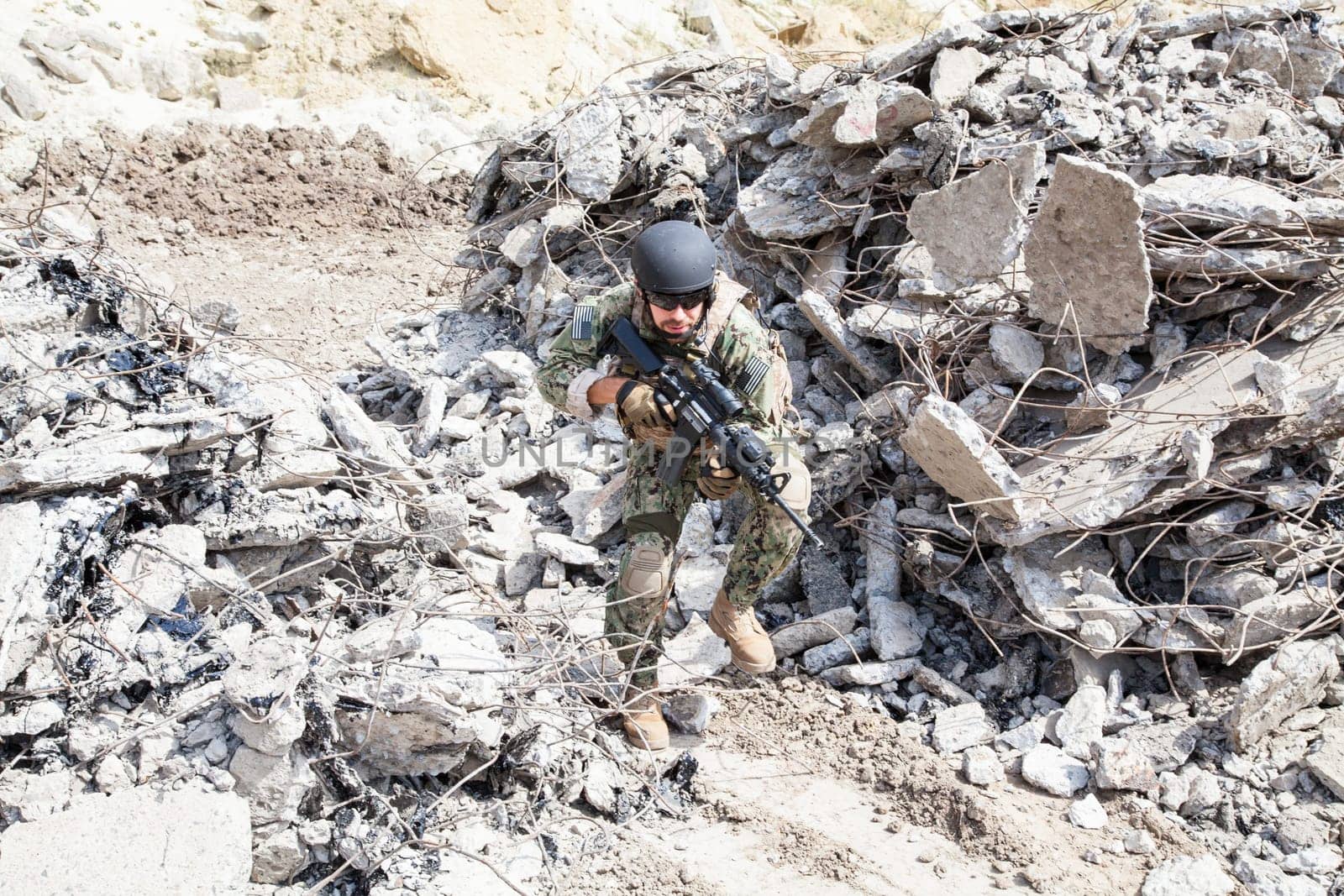 Member of Navy SEAL Team with weapons in action